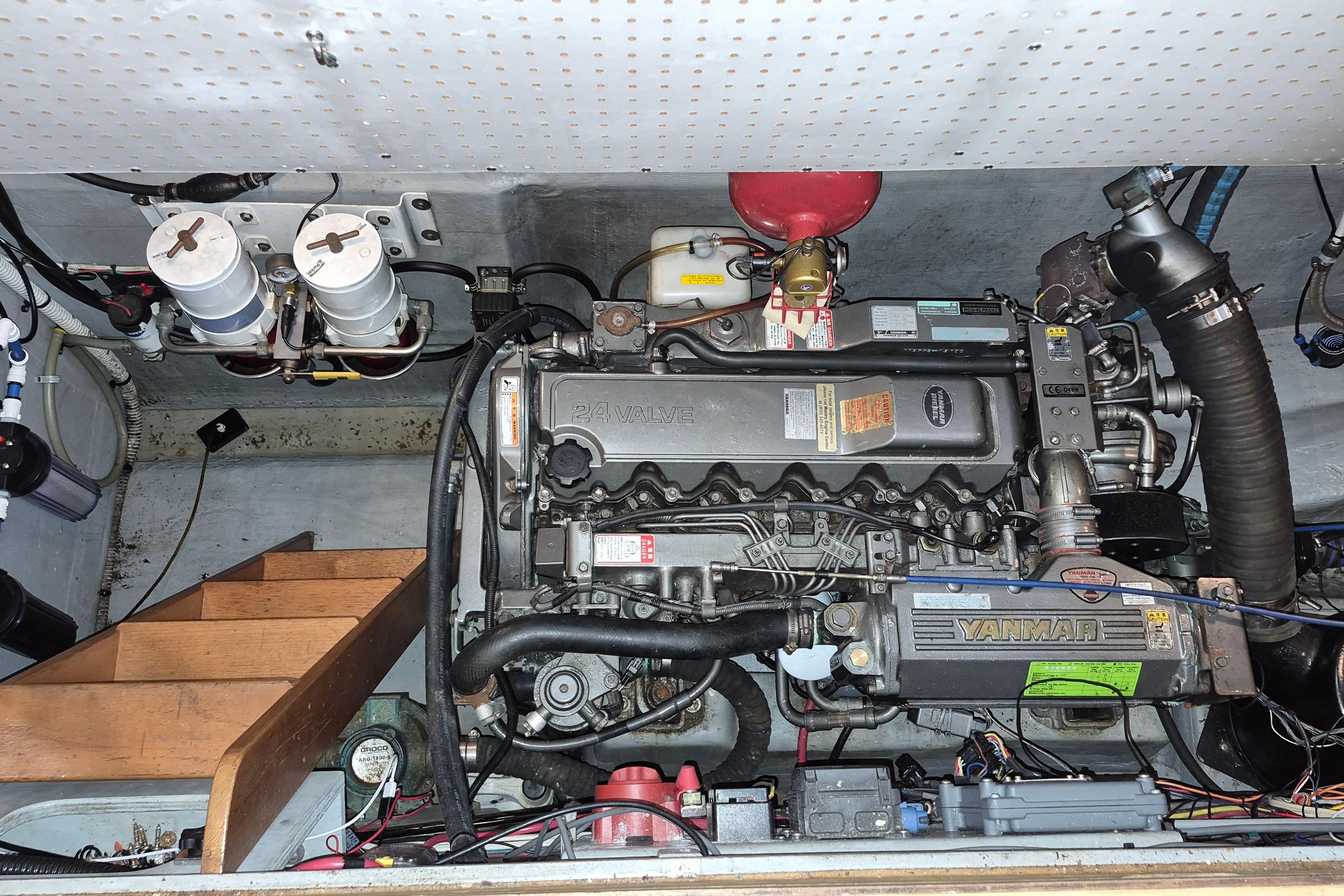 Engine room of 2009 Endeavour 40 Skylounge with Yanmar engine and dual fuel filters.
