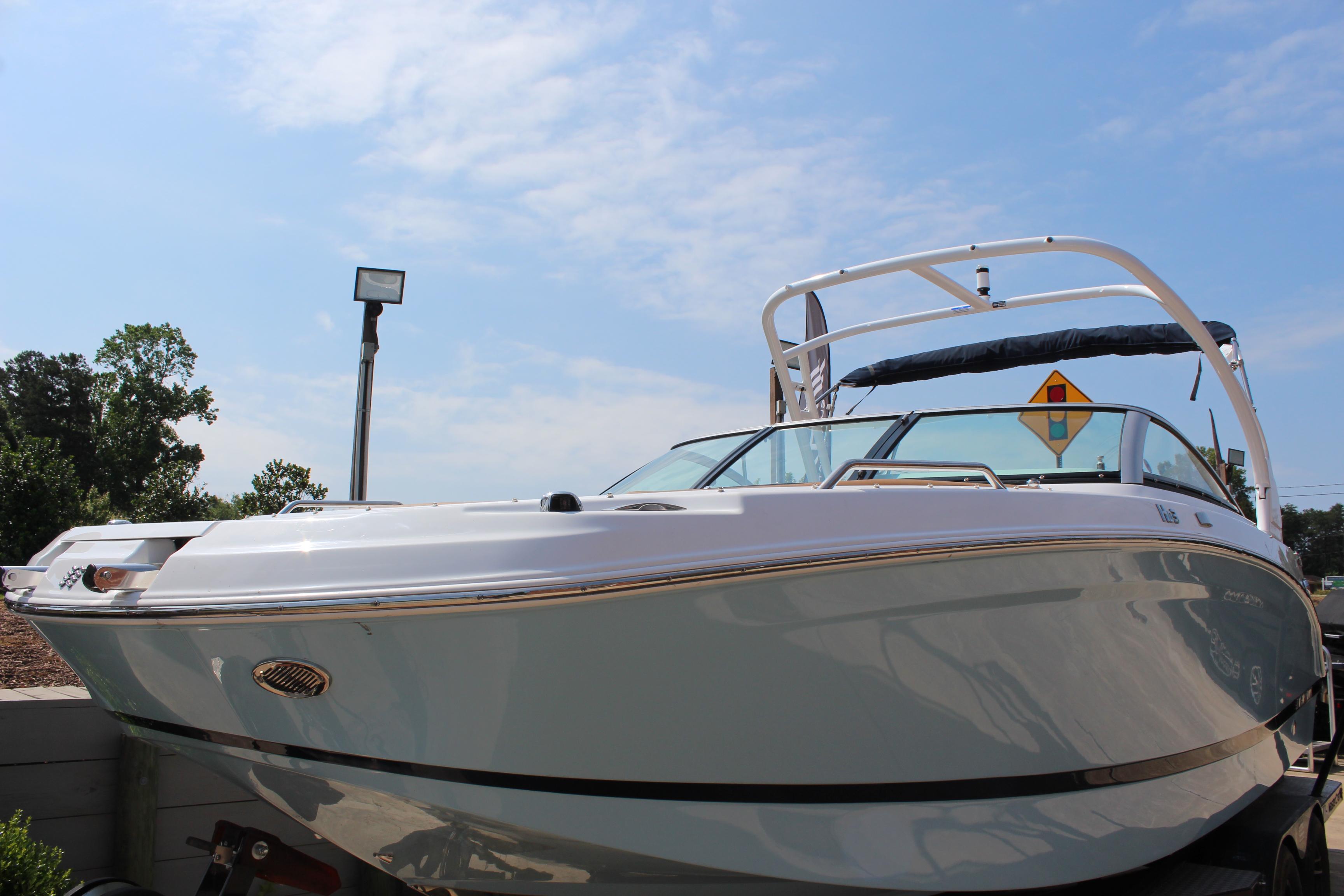 2025 Four Winns HD3 OB boat under clear blue sky.