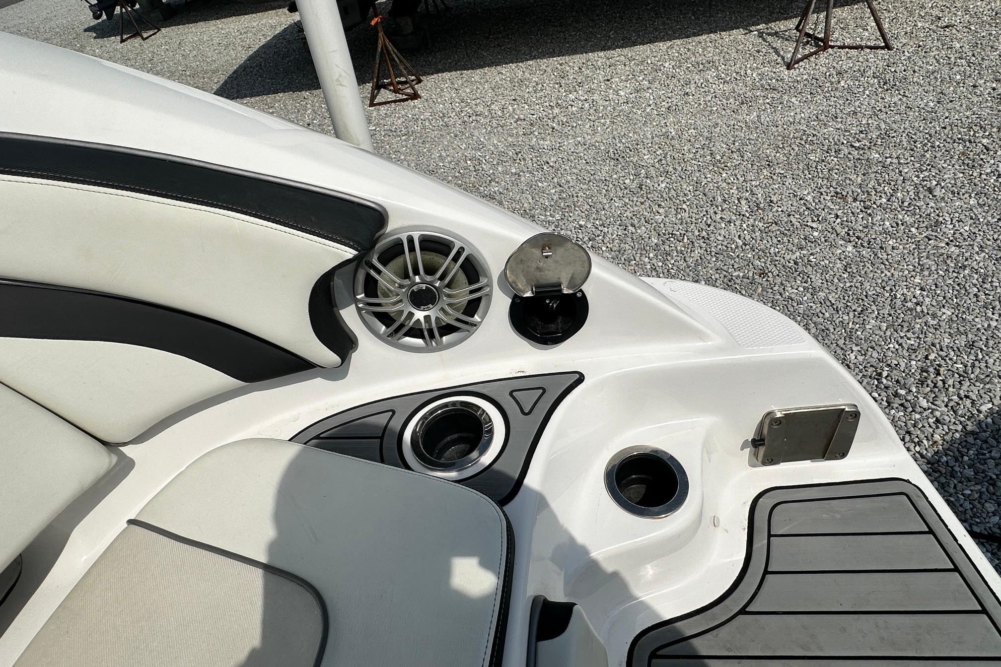 Interior of 2016 Yamaha 242 Limited S boat with speaker and seating.