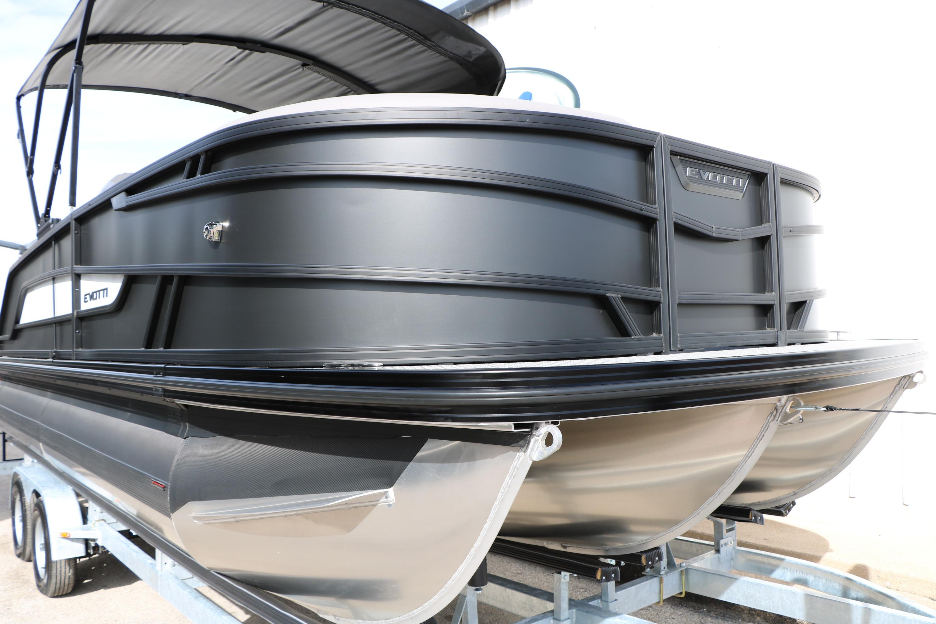 2026 Evotti 521QL pontoon boat with sleek black design on a trailer.