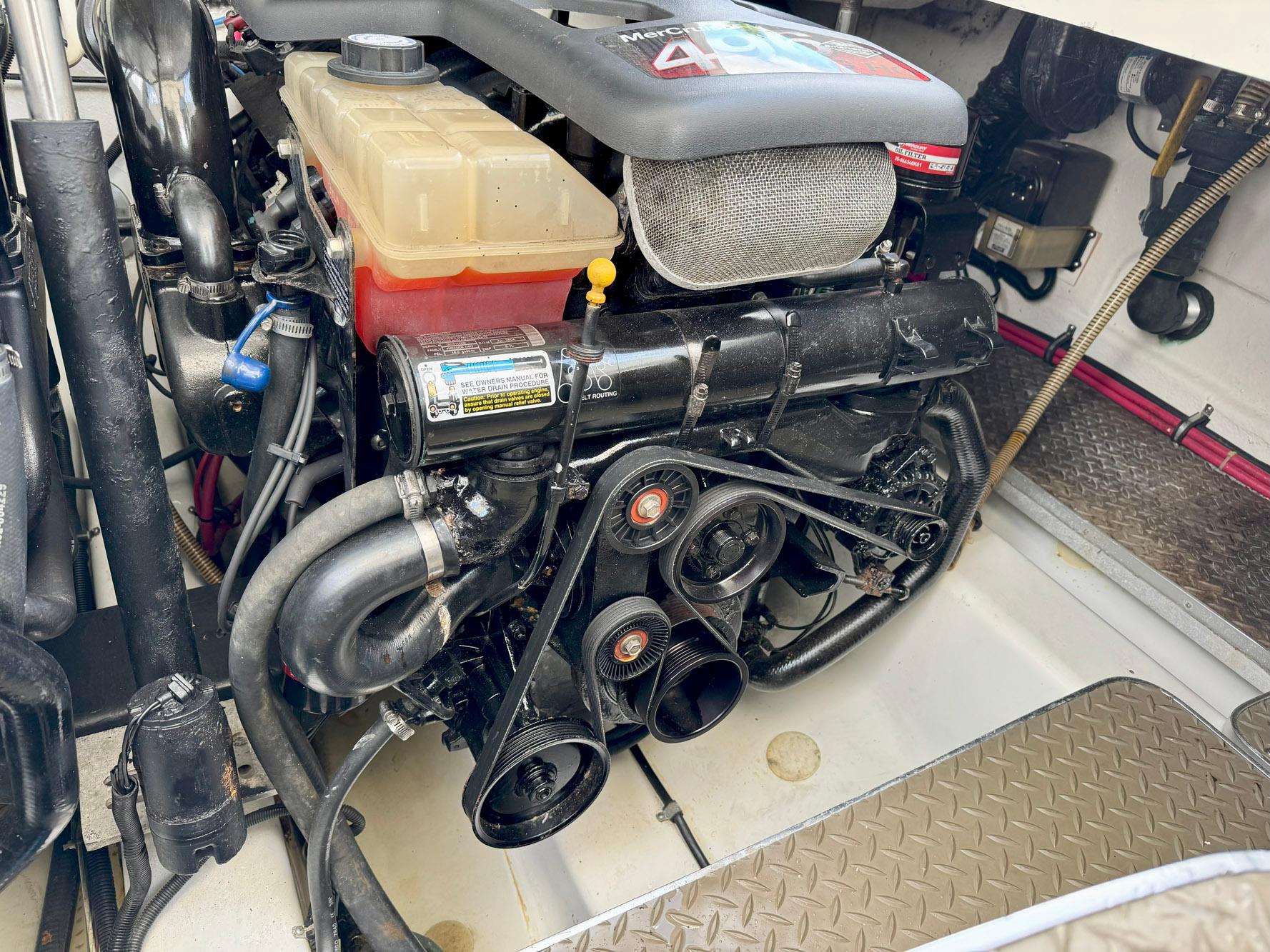 Engine compartment of a 1999 Formula 400 Super Sport boat, featuring a MerCruiser engine.
