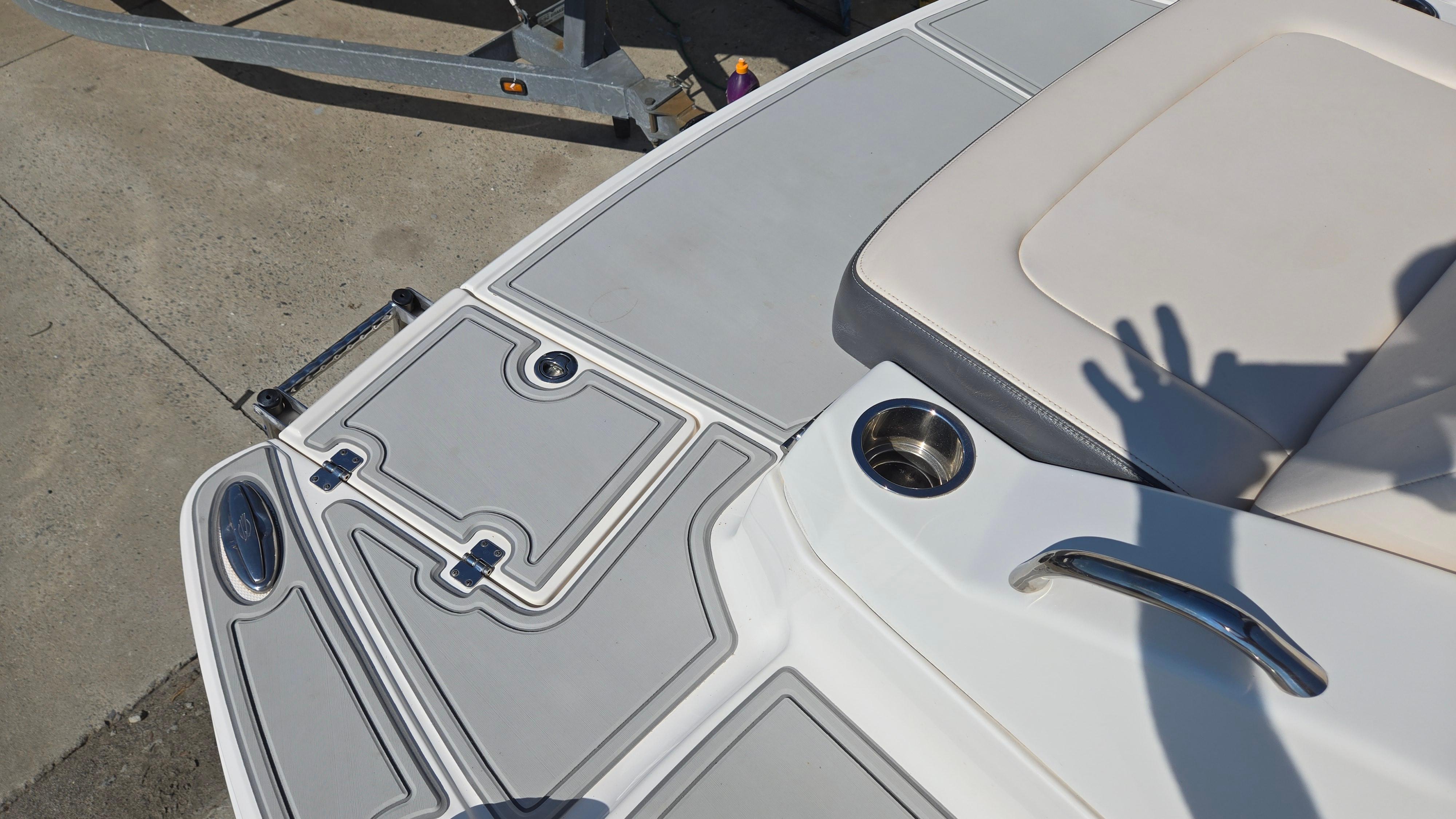 2018 Chaparral 224 Sunesta boat deck with seating and cup holder.