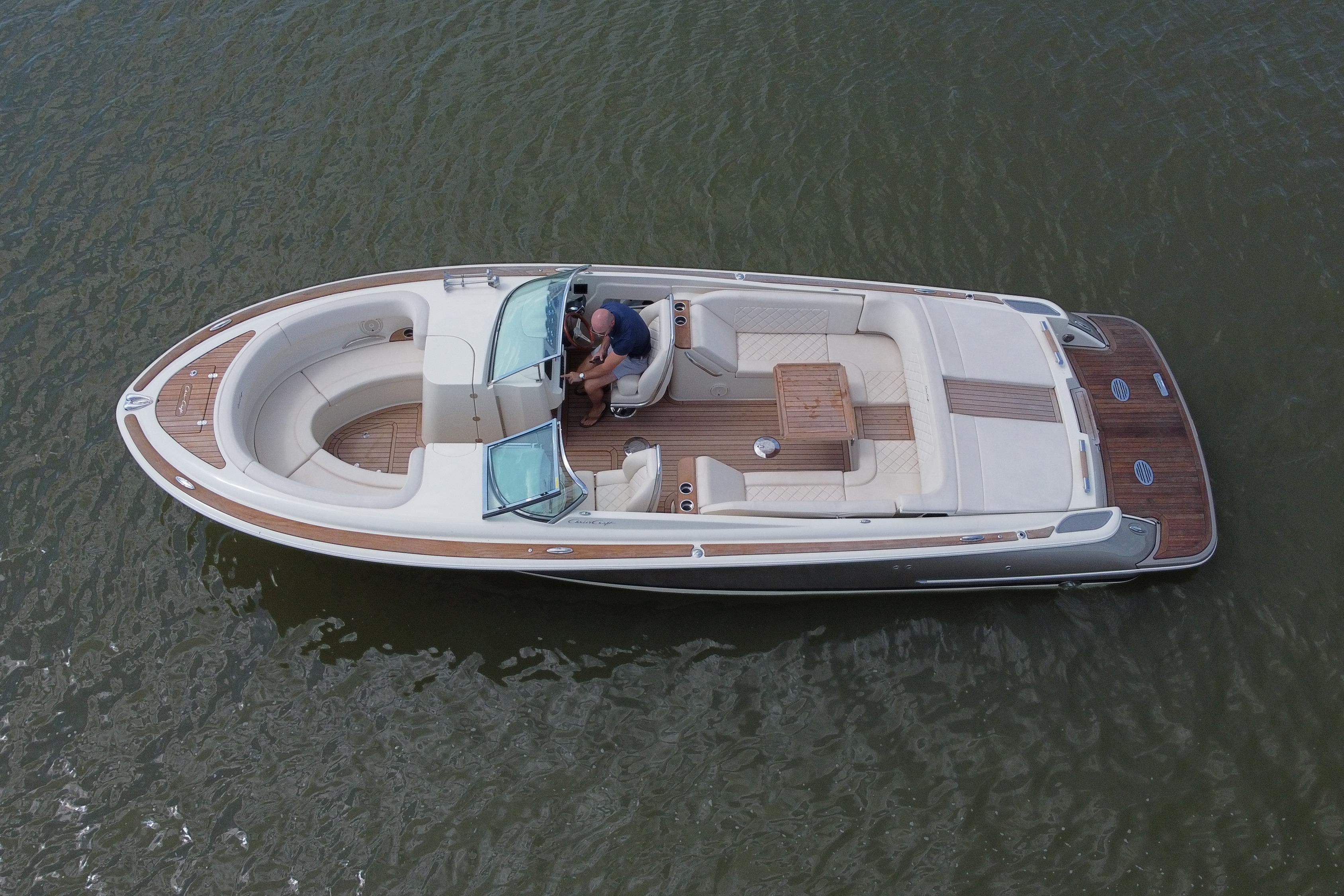 2019 Chris-Craft Launch 30 boat on water, featuring elegant design and spacious seating.