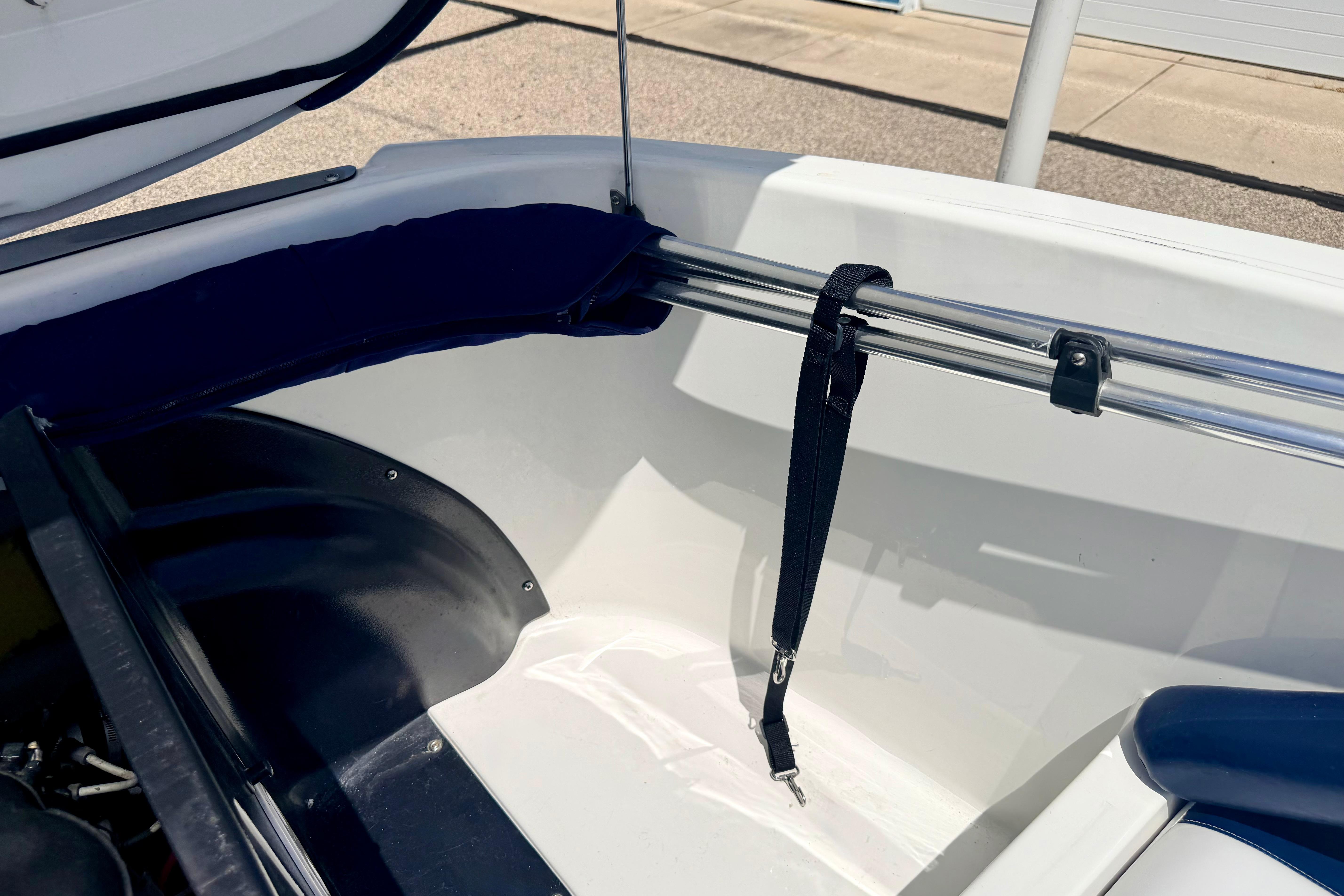 2004 Bombardier SEADOO Utopia 185 interior detail with storage compartment and safety strap.