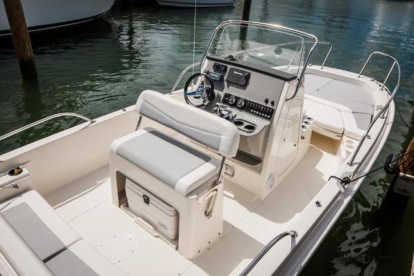 Manufacturer Provided Image: 2014 Boston Whaler 210 Dauntless boat interior with helm and seating.