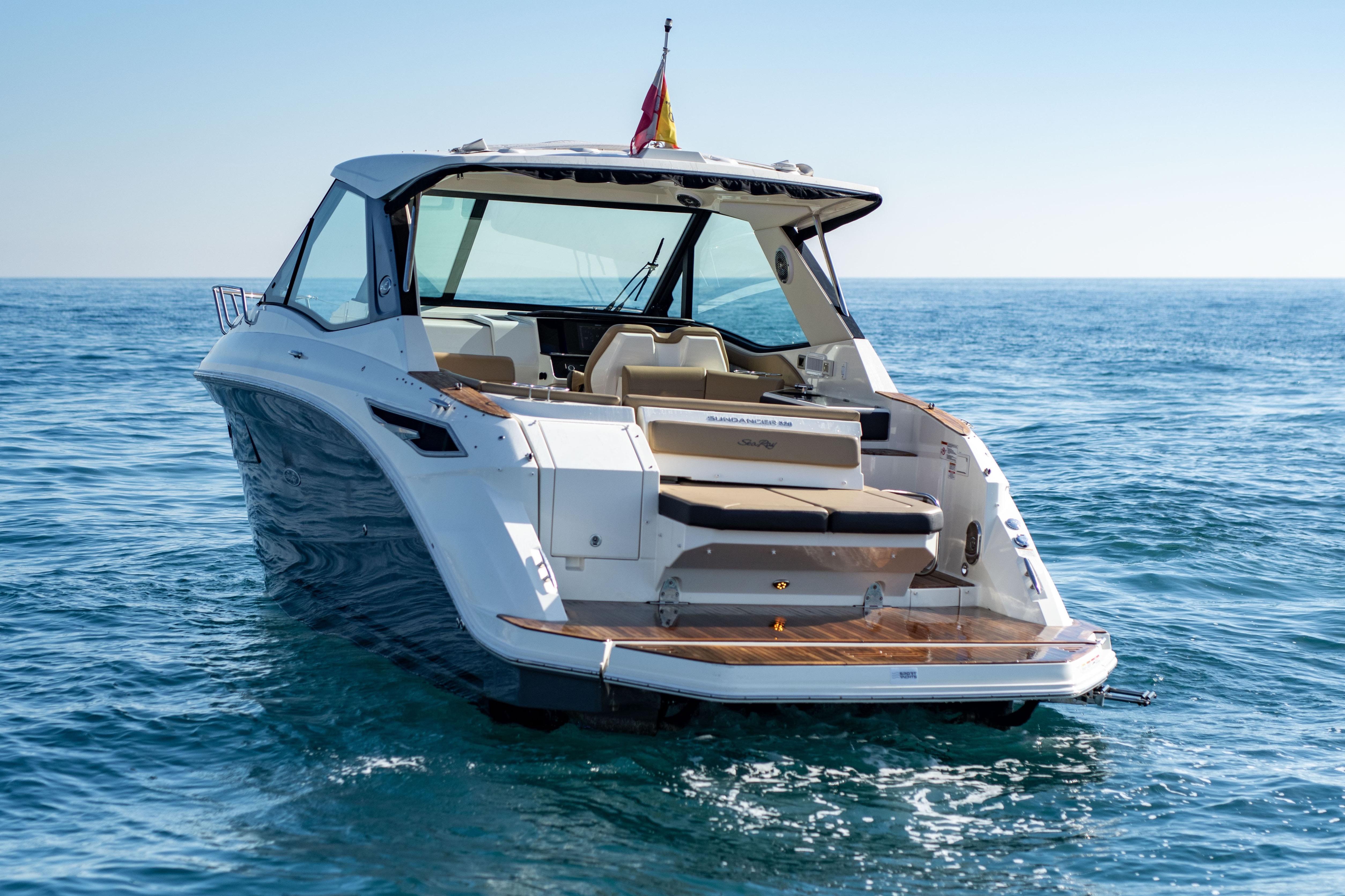 2022 Sea Ray Sundancer 320 yacht on open water, rear view.