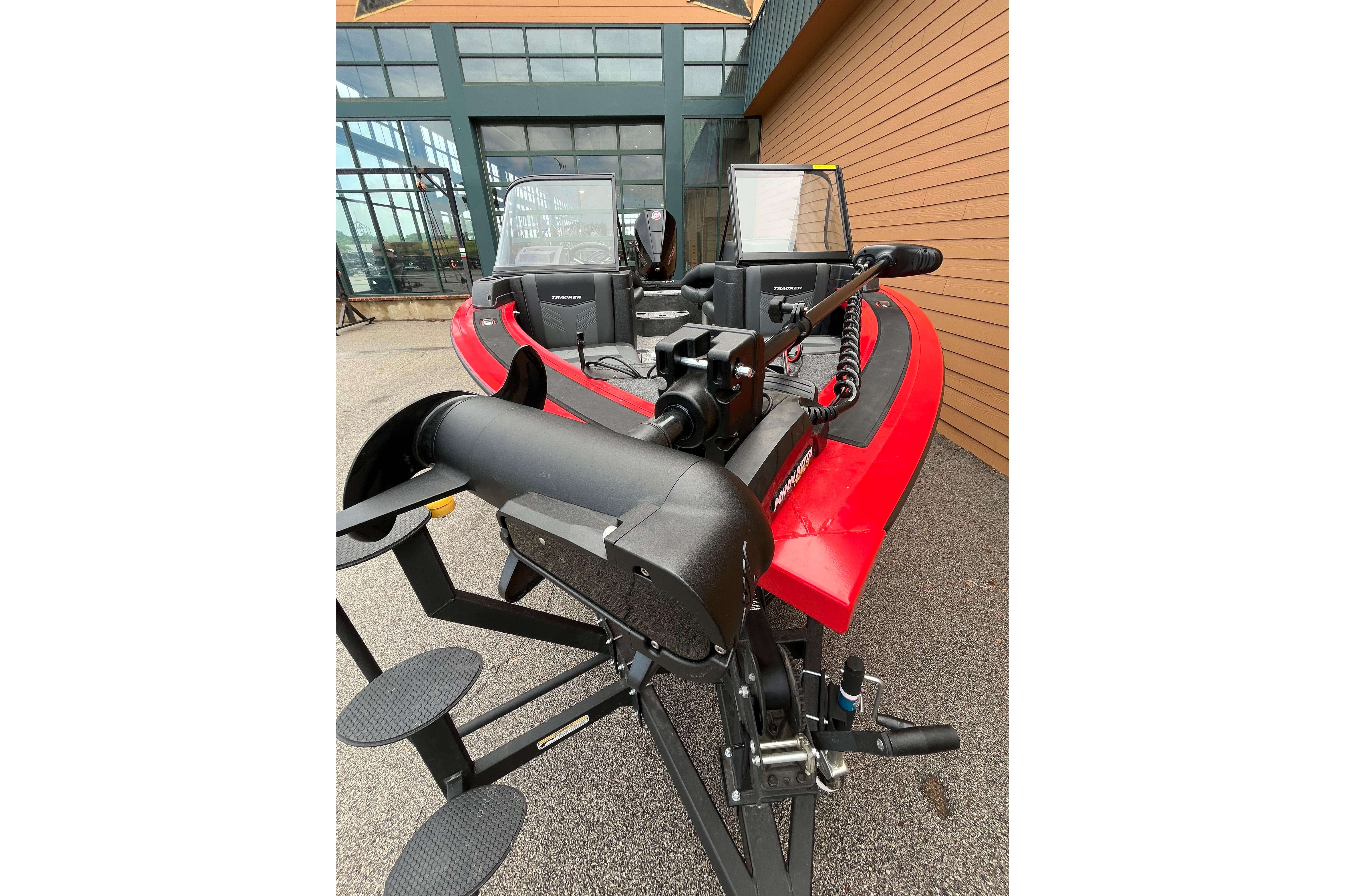 2026 Tracker Targa V-18 Combo boat, red exterior, parked outdoors.