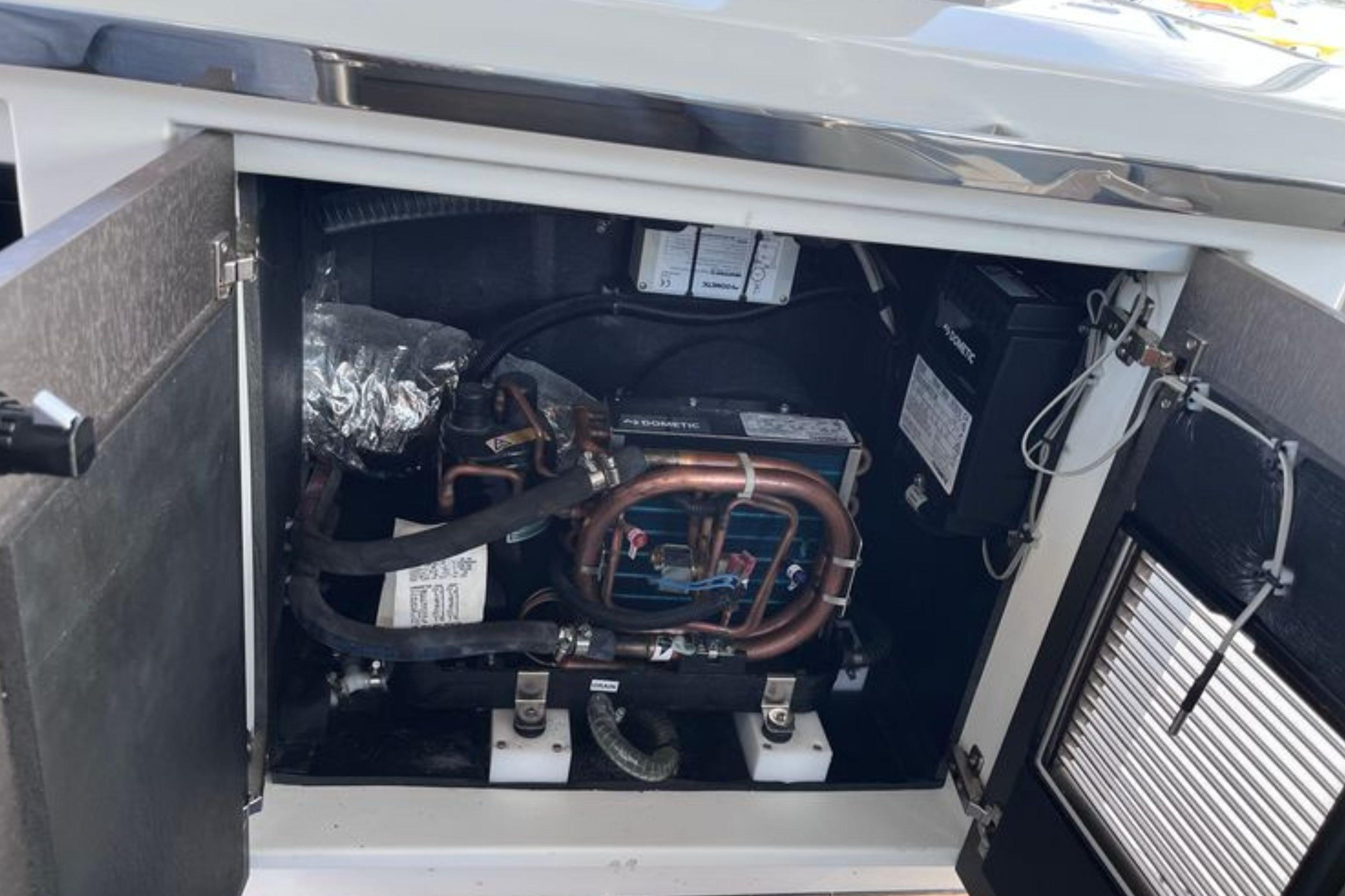 Engine compartment of 2024 Galeon 425 HTS yacht, showcasing mechanical components and wiring.