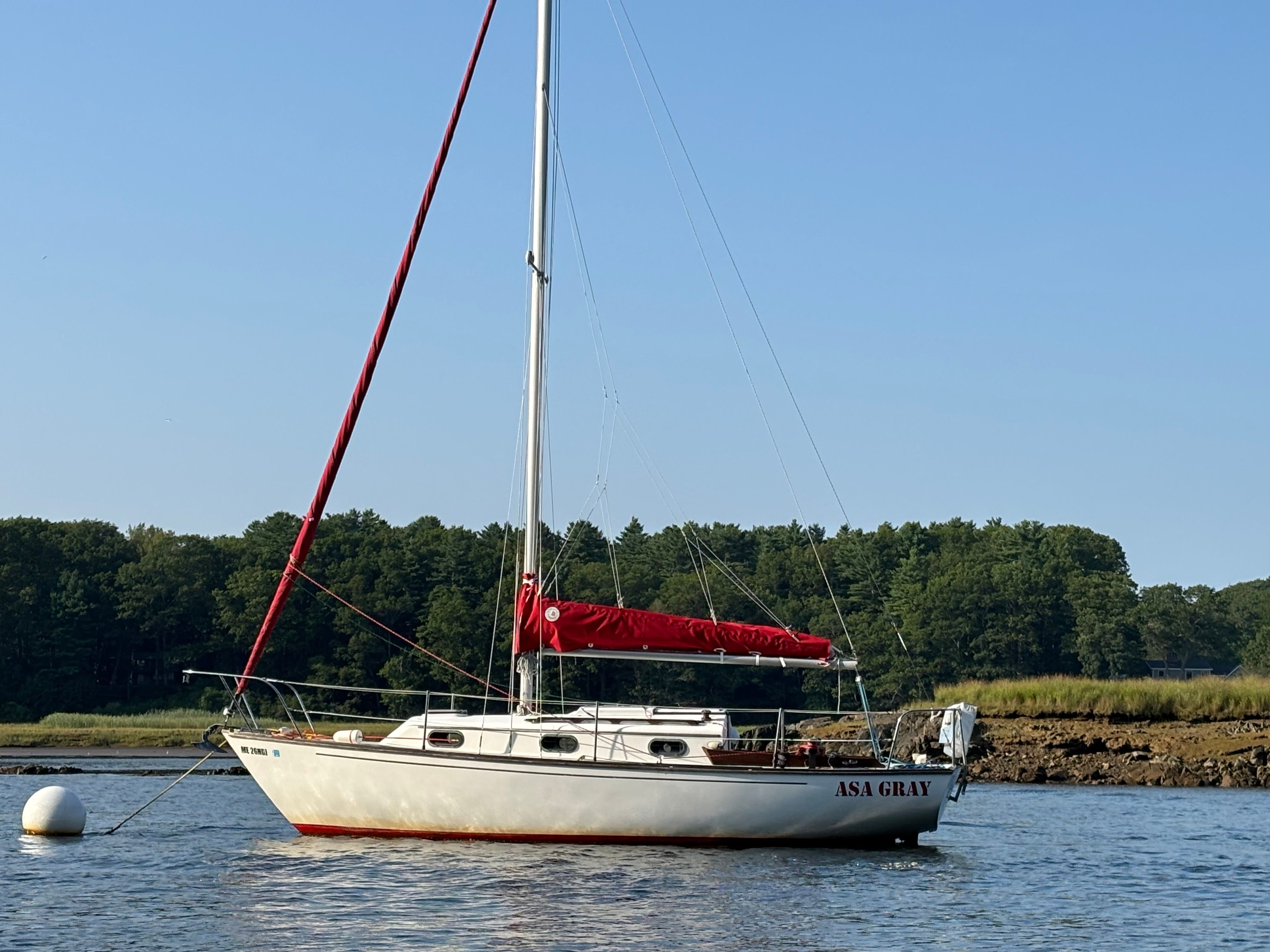 1986 Cape Dory 26 sailboat on calm water.