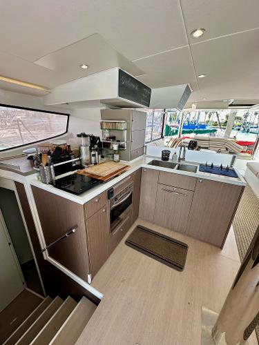 Modern kitchen interior on a 2021 Bali 4.8 yacht, featuring sleek cabinetry and appliances.