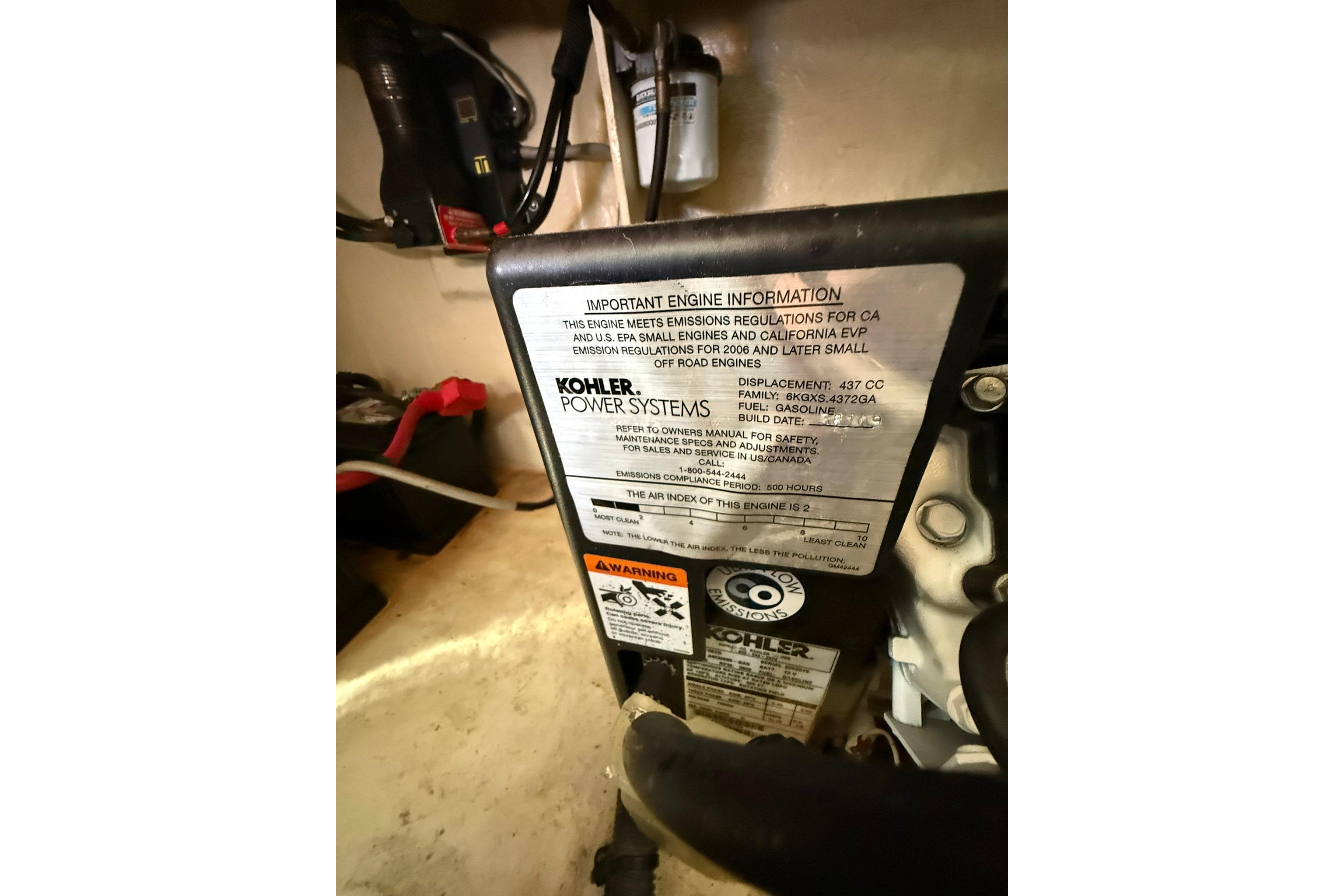 Engine compartment of 2009 Sea Ray 350 Sundancer with Kohler power system label.