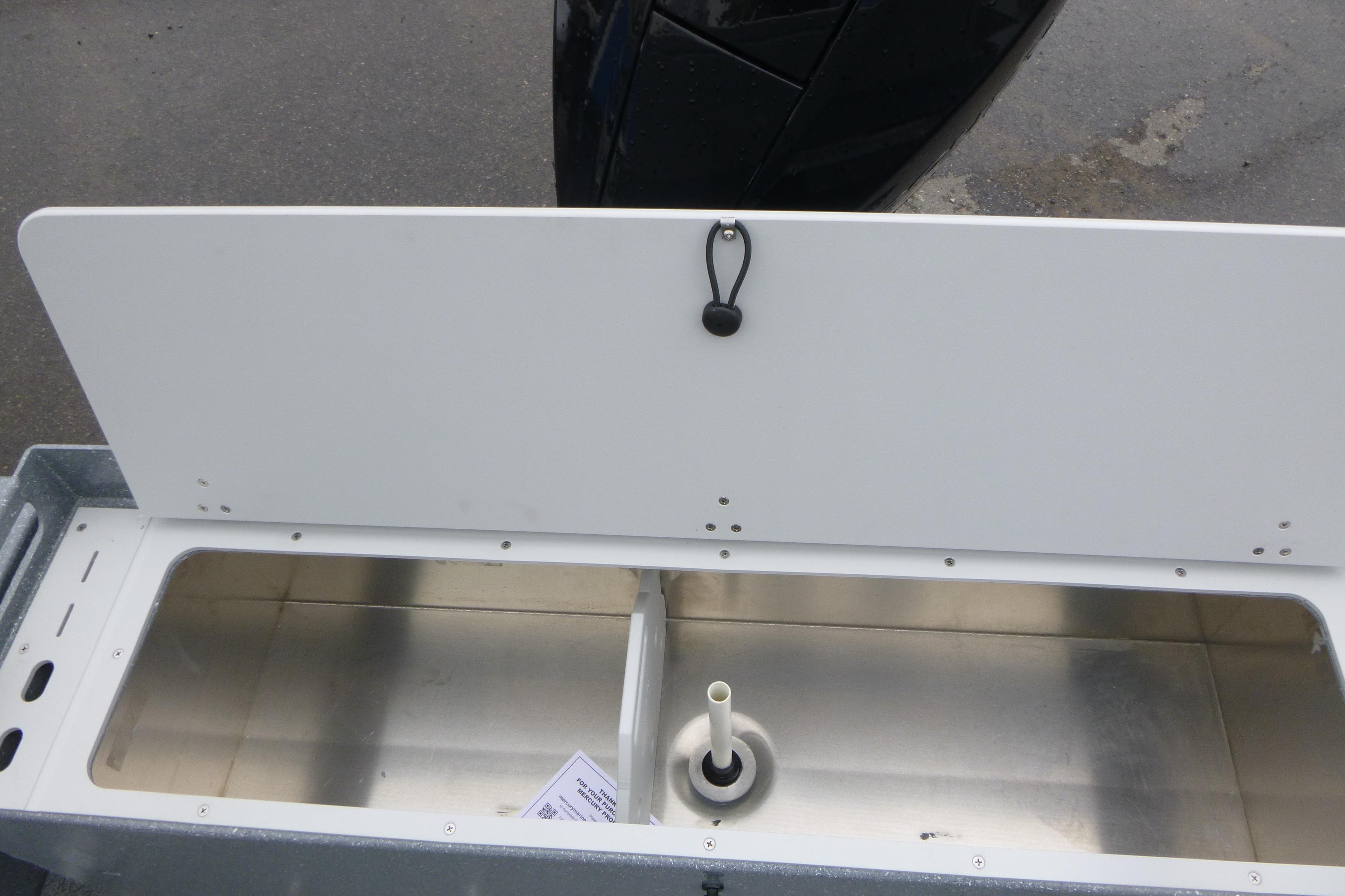 Open storage compartment in 2026 KingFisher 2025 Escape boat, featuring a sleek design.