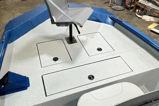 2025 SeaArk Shadow 187T boat interior with storage compartments and seating.
