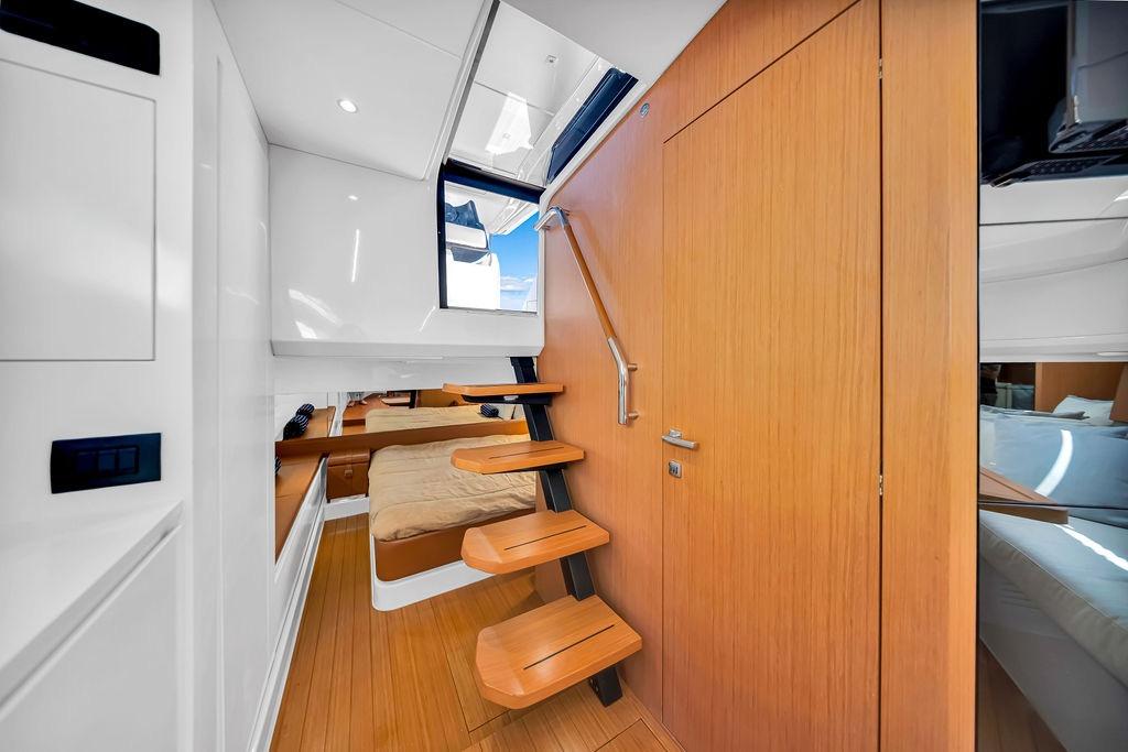 Interior of 2021 Bluegame BG 42 yacht with wooden stairs and modern design.