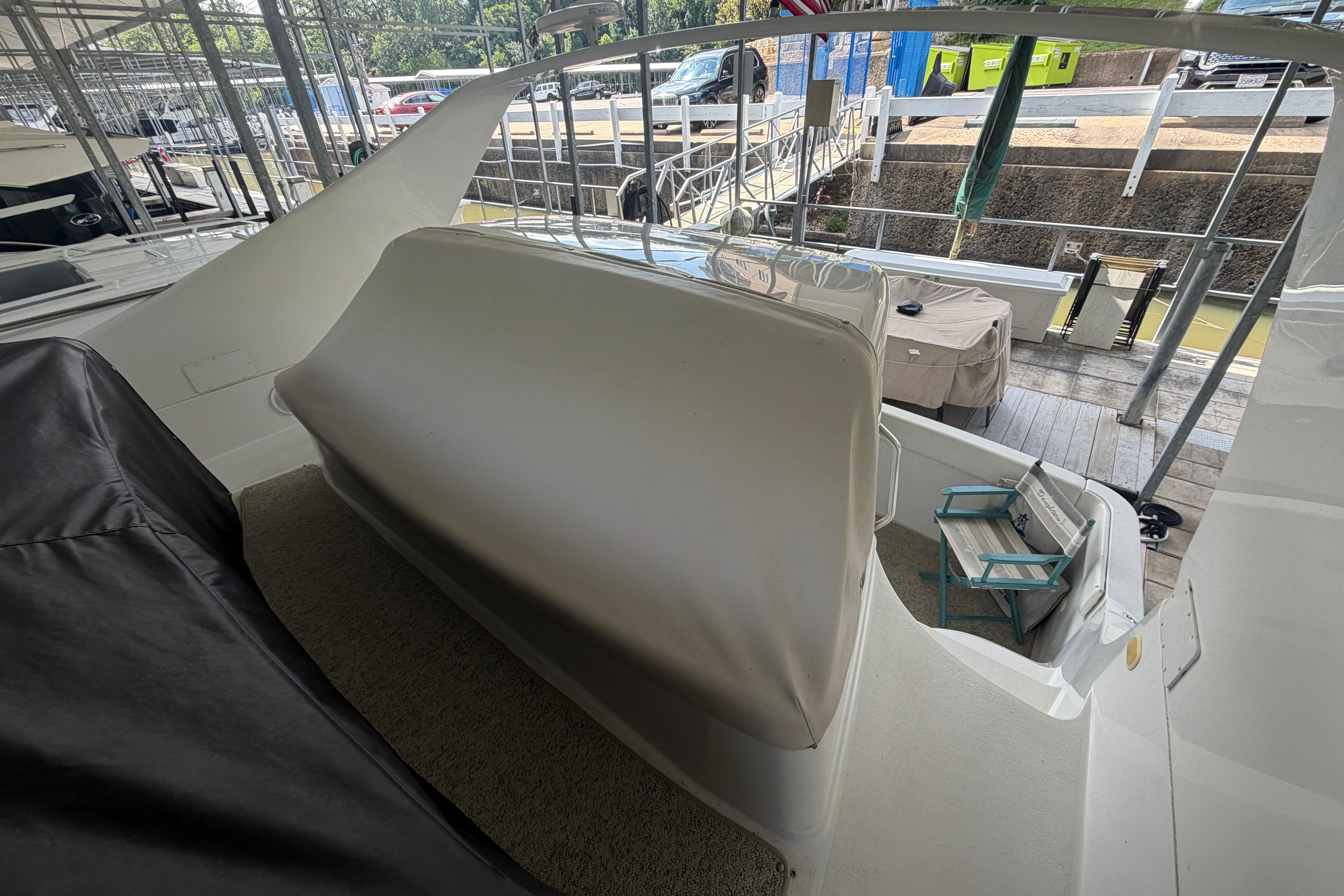 2000 Carver 350 Mariner yacht interior with seating area and dock view.