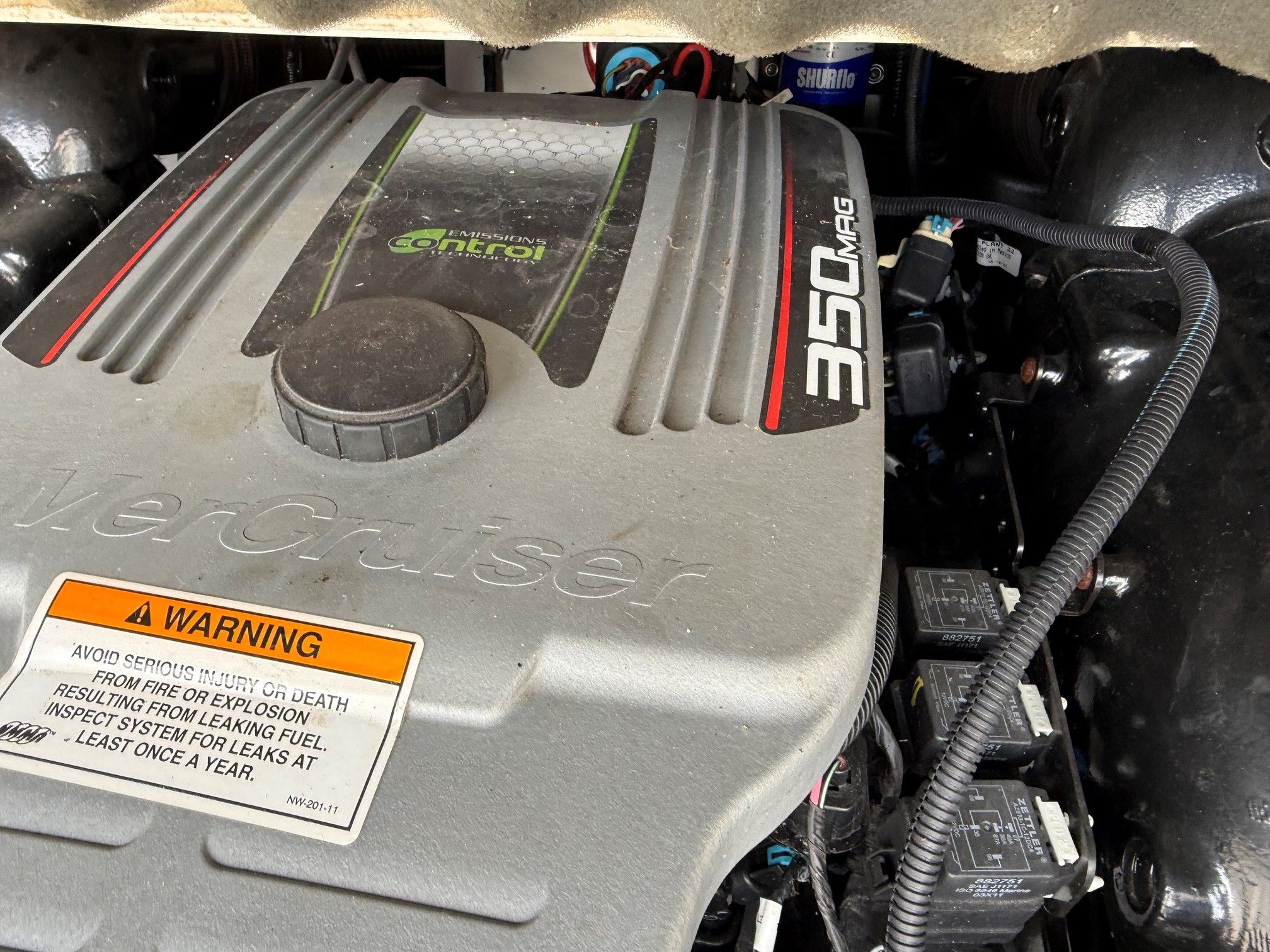 Engine compartment of a 2012 Crownline 252 EX boat with a MerCruiser 350 Mag engine.