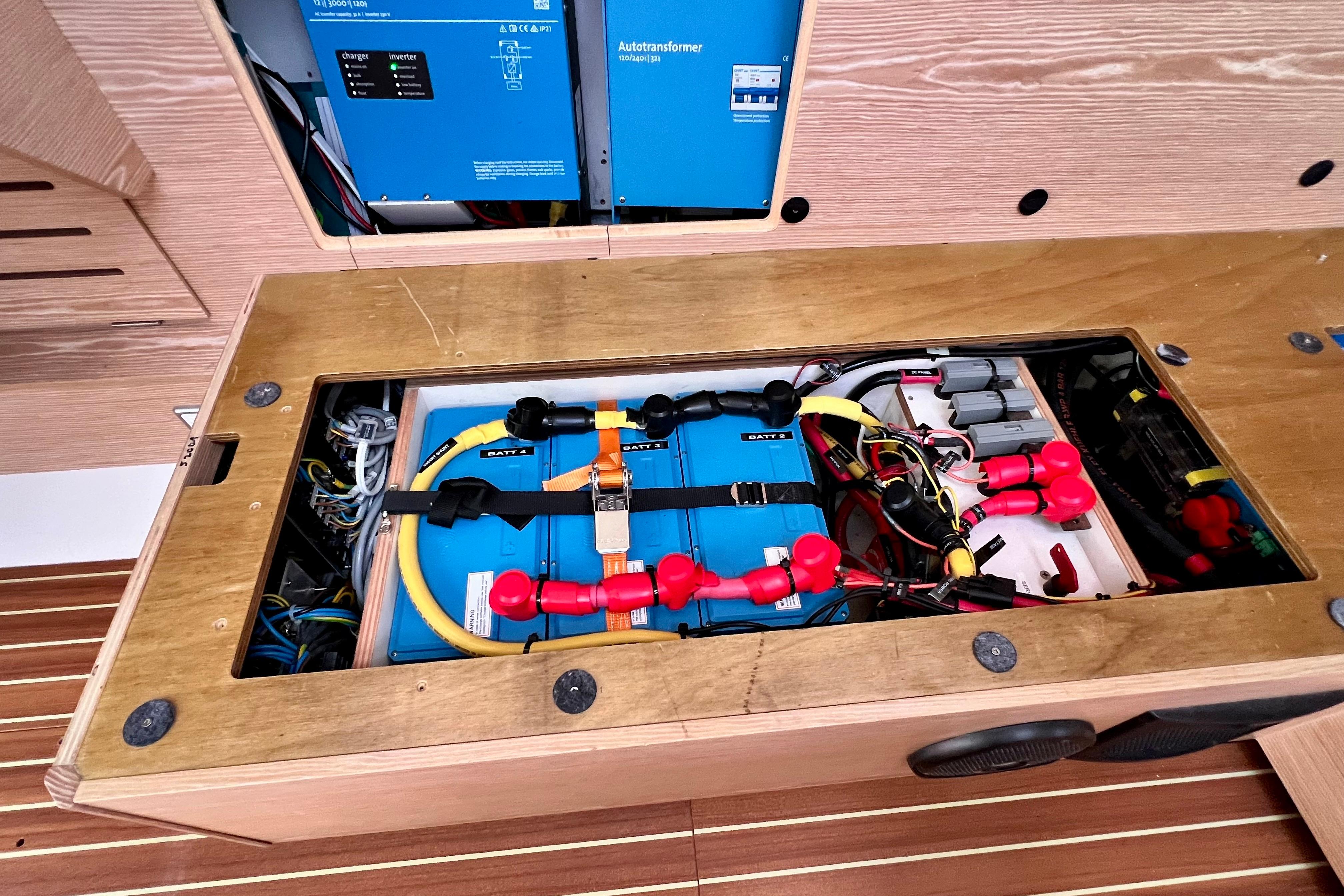 Electrical system of a 2016 Hanse 455 yacht, featuring batteries and wiring.