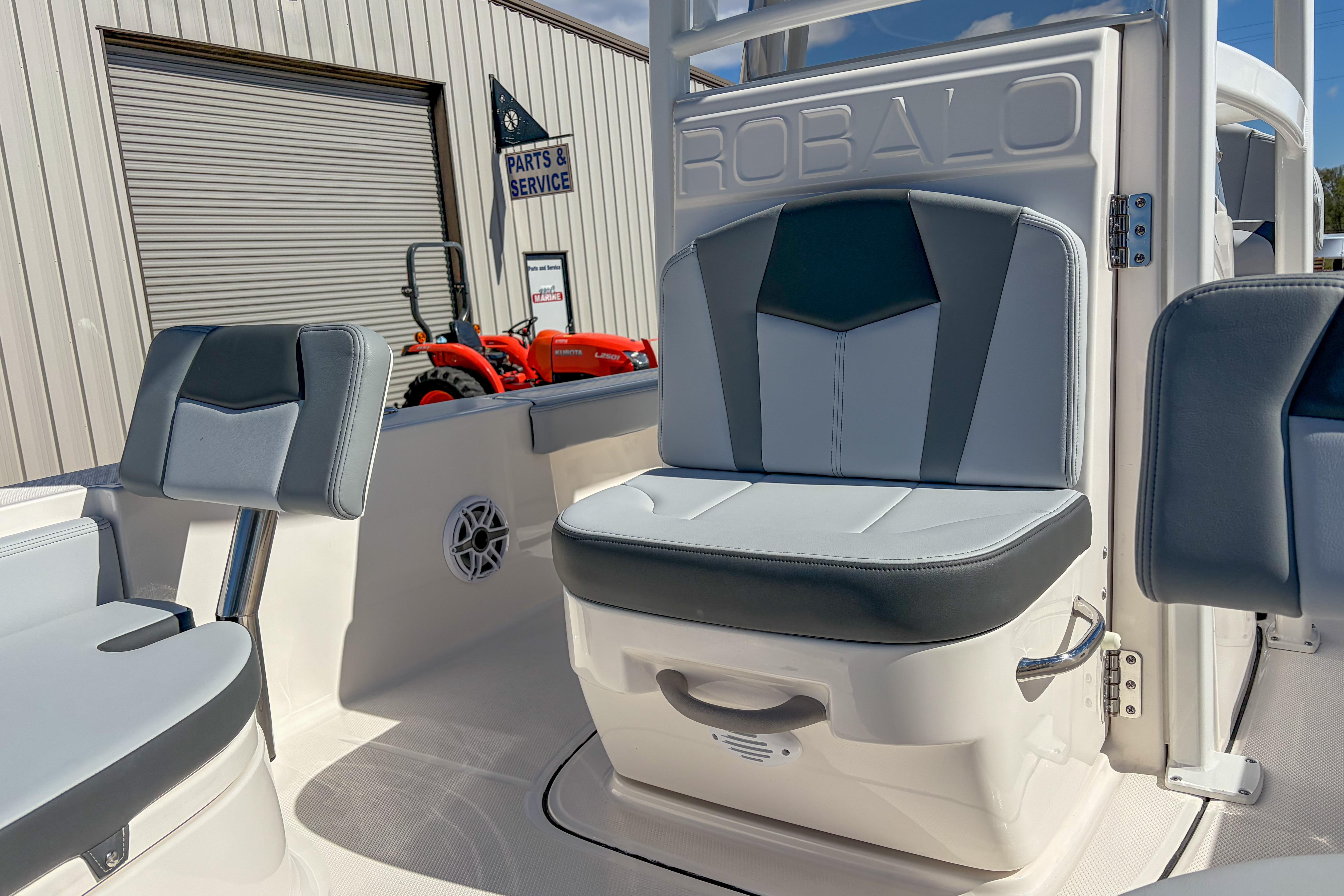 2025 Robalo 226 Cayman boat interior with gray seating and parts service sign.