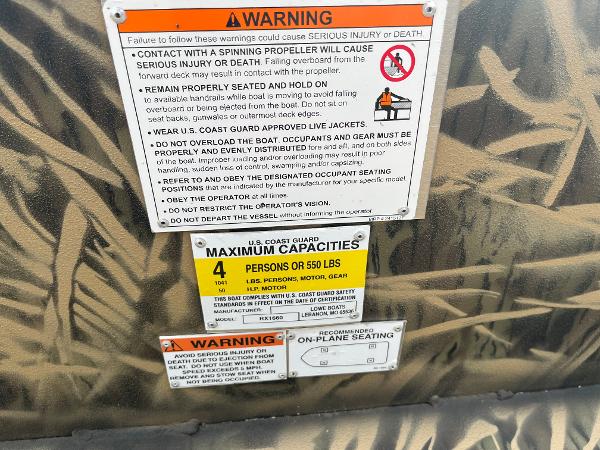 2024 Lowe Roughneck 1660 warning labels and maximum capacity information.