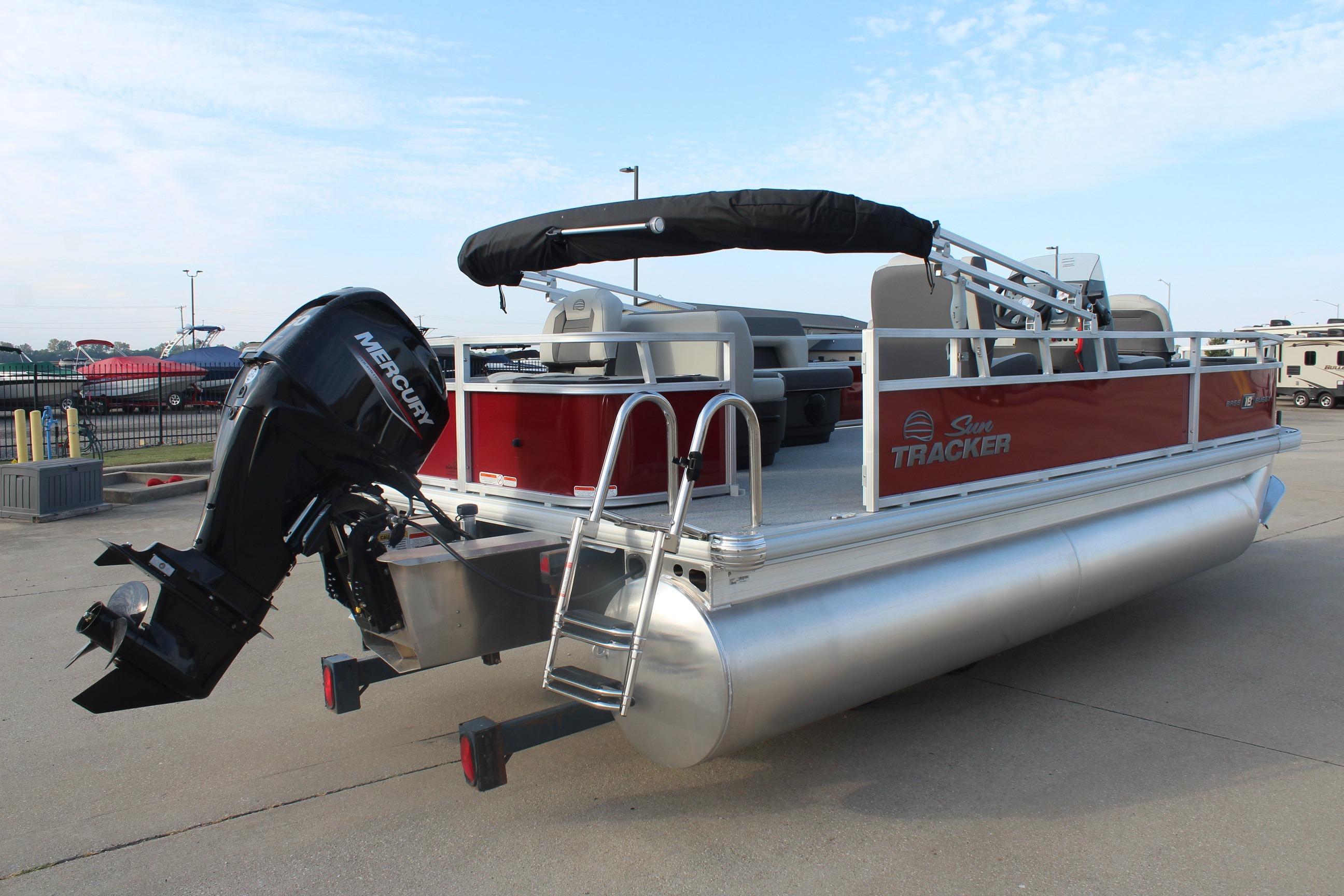 2026 Sun Tracker Bass Buggy 18 DLX pontoon boat with Mercury outboard motor.