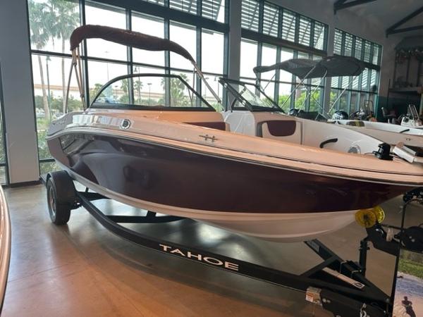 2023 Tahoe 185 S boat on display in a showroom.