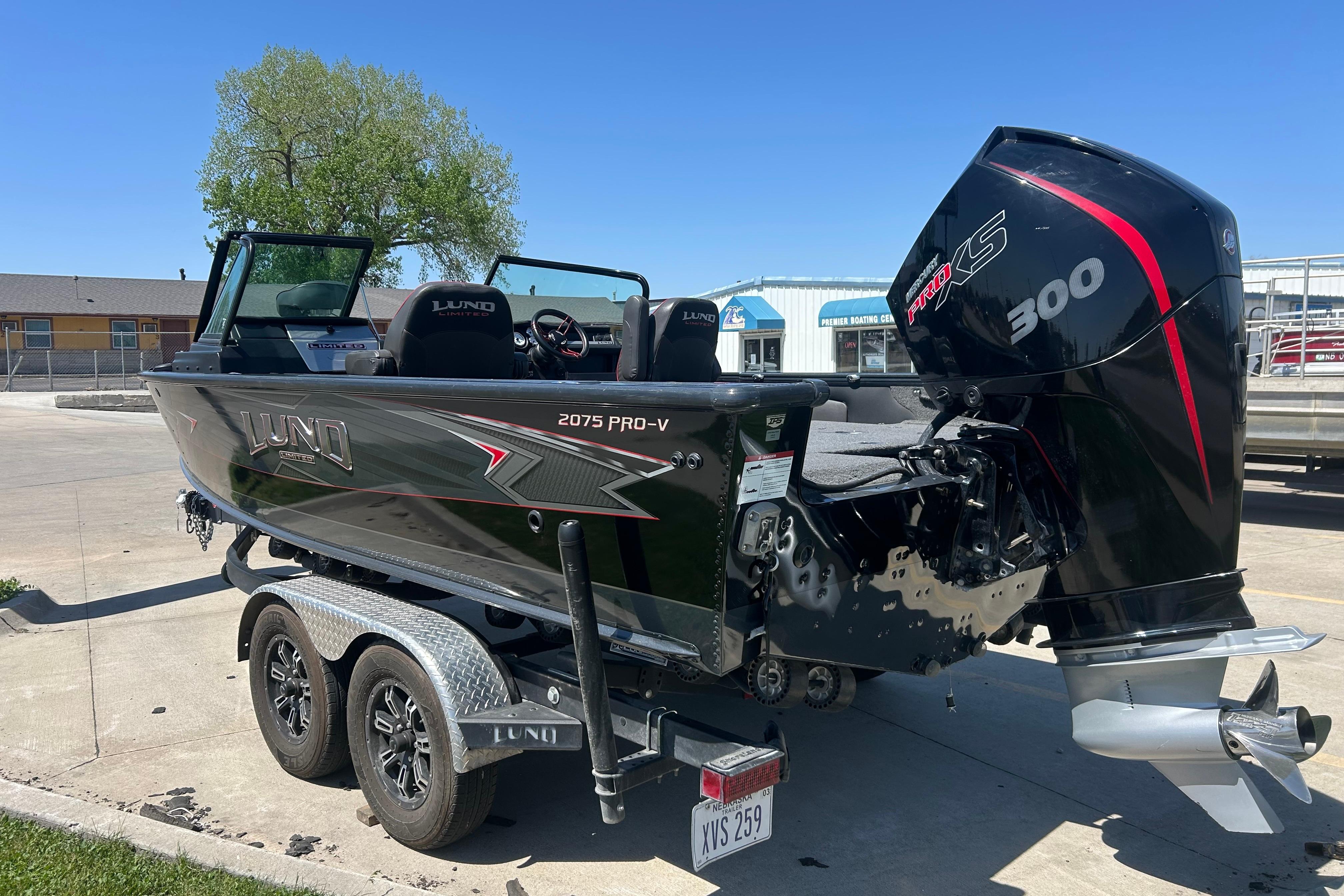 2021 Lund 2075 Pro-V Limited boat with powerful 300 HP engine on trailer.