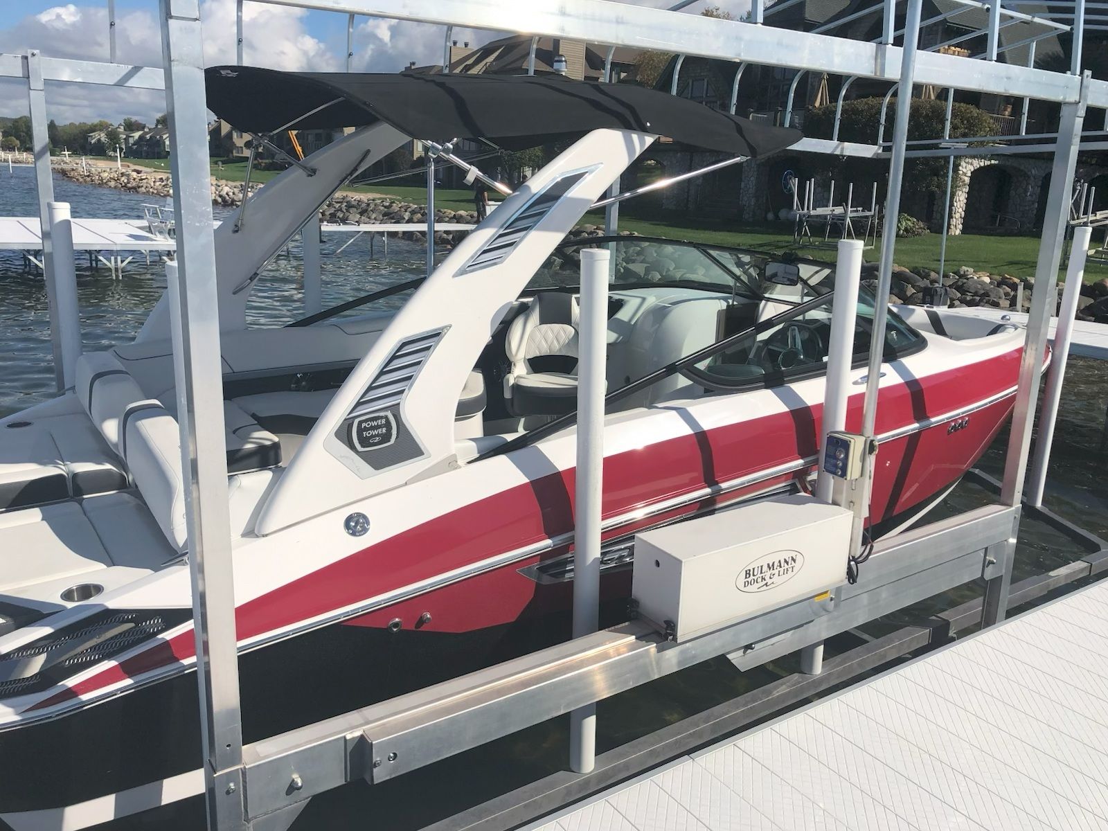 2019 Regal 25 RX Surf boat on a dock.