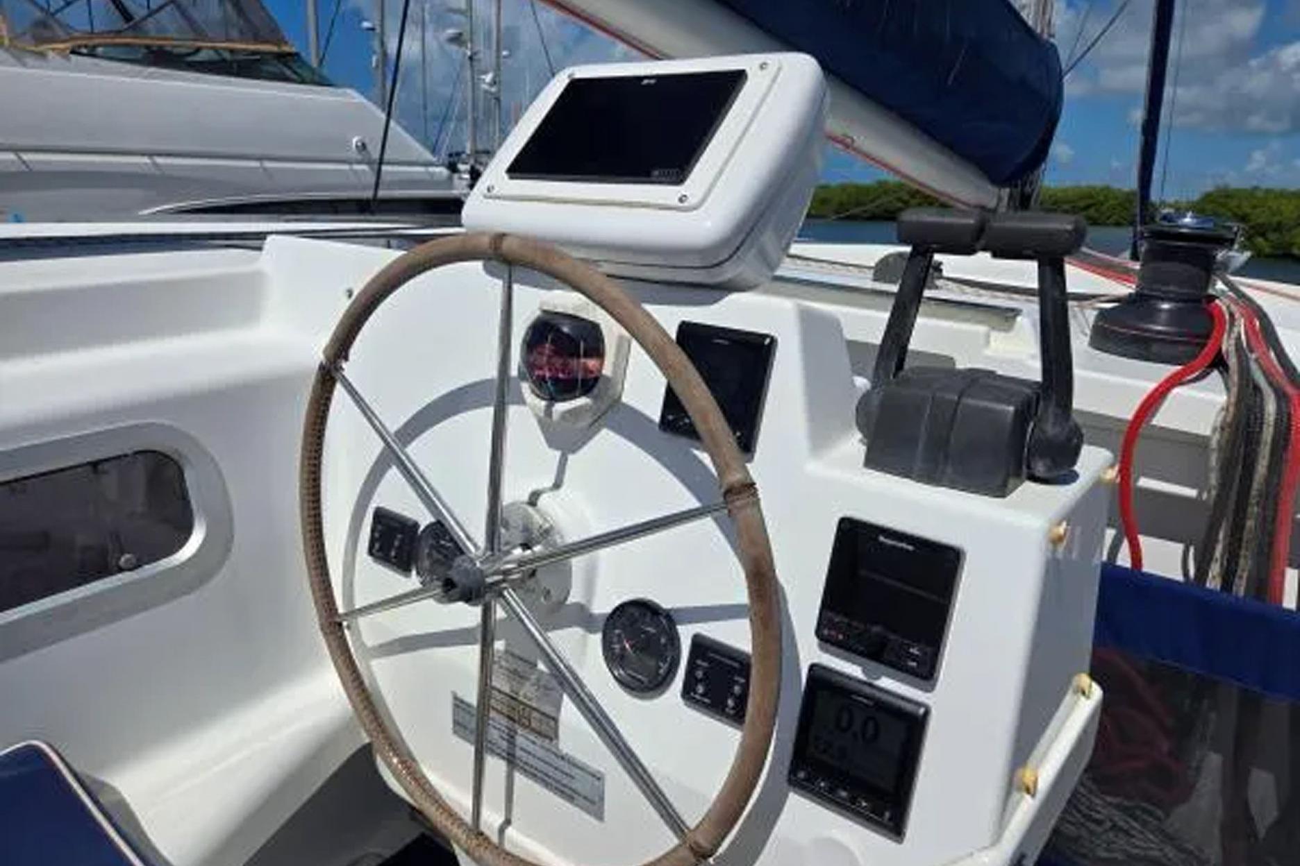 Helm of 2008 Fountaine Pajot Salina 48 catamaran with navigation instruments.