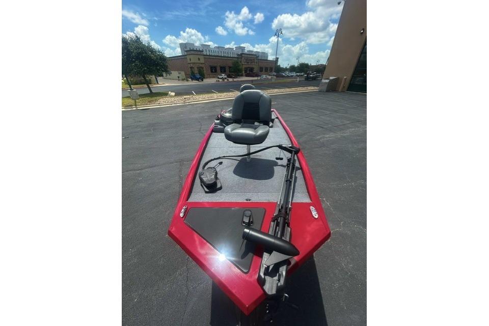 2026 Tracker Pro 170 boat, red exterior, parked outdoors under a sunny sky.