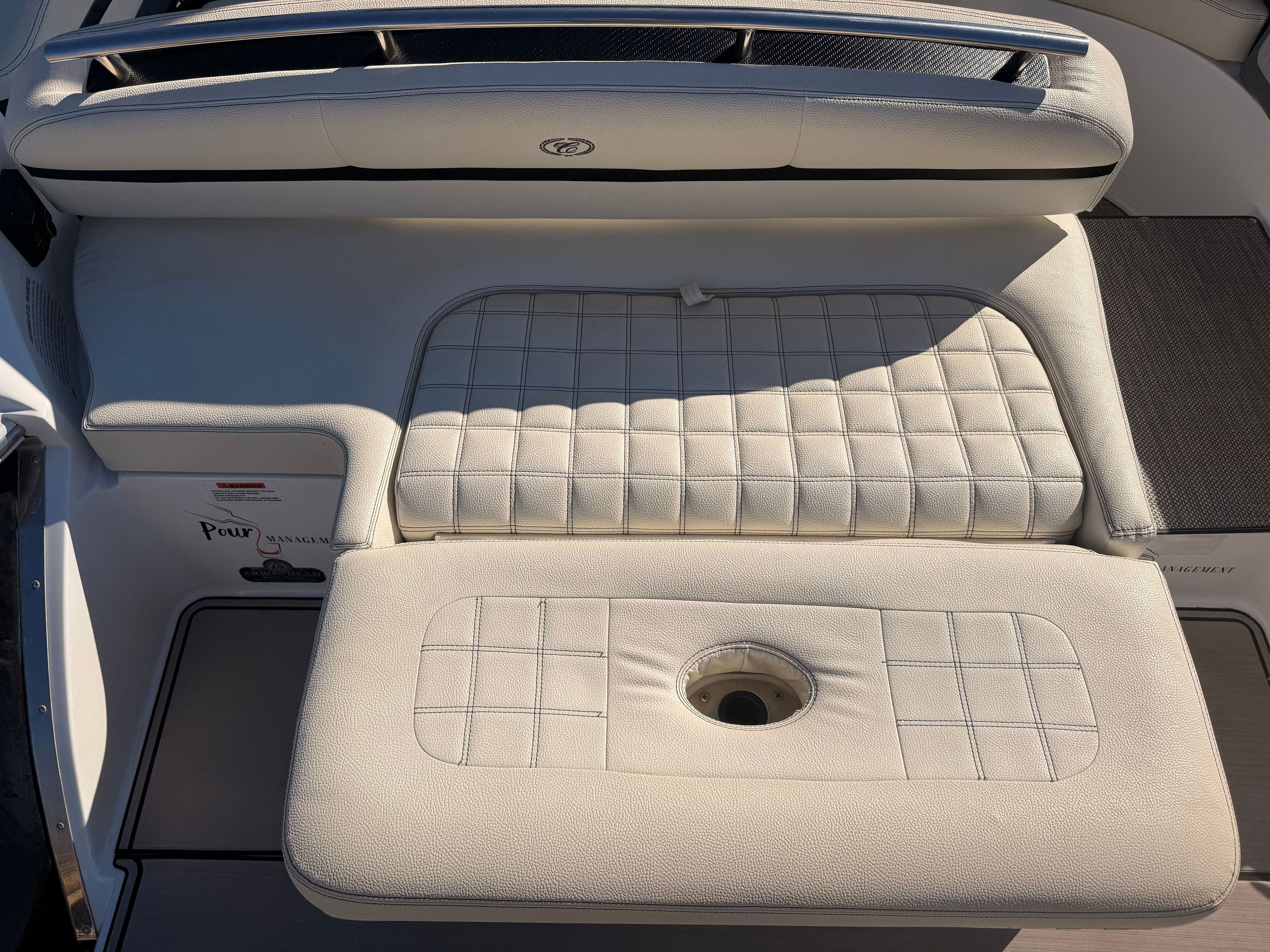 The image shows the cushioned aft deck of a 2019 Cobalt R7 Surf boat.