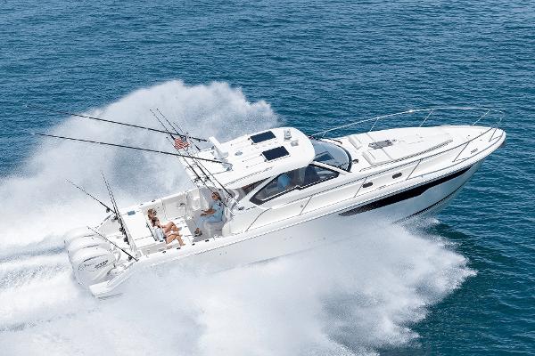 2025 Pursuit OS 405 boat cruising swiftly on open water.