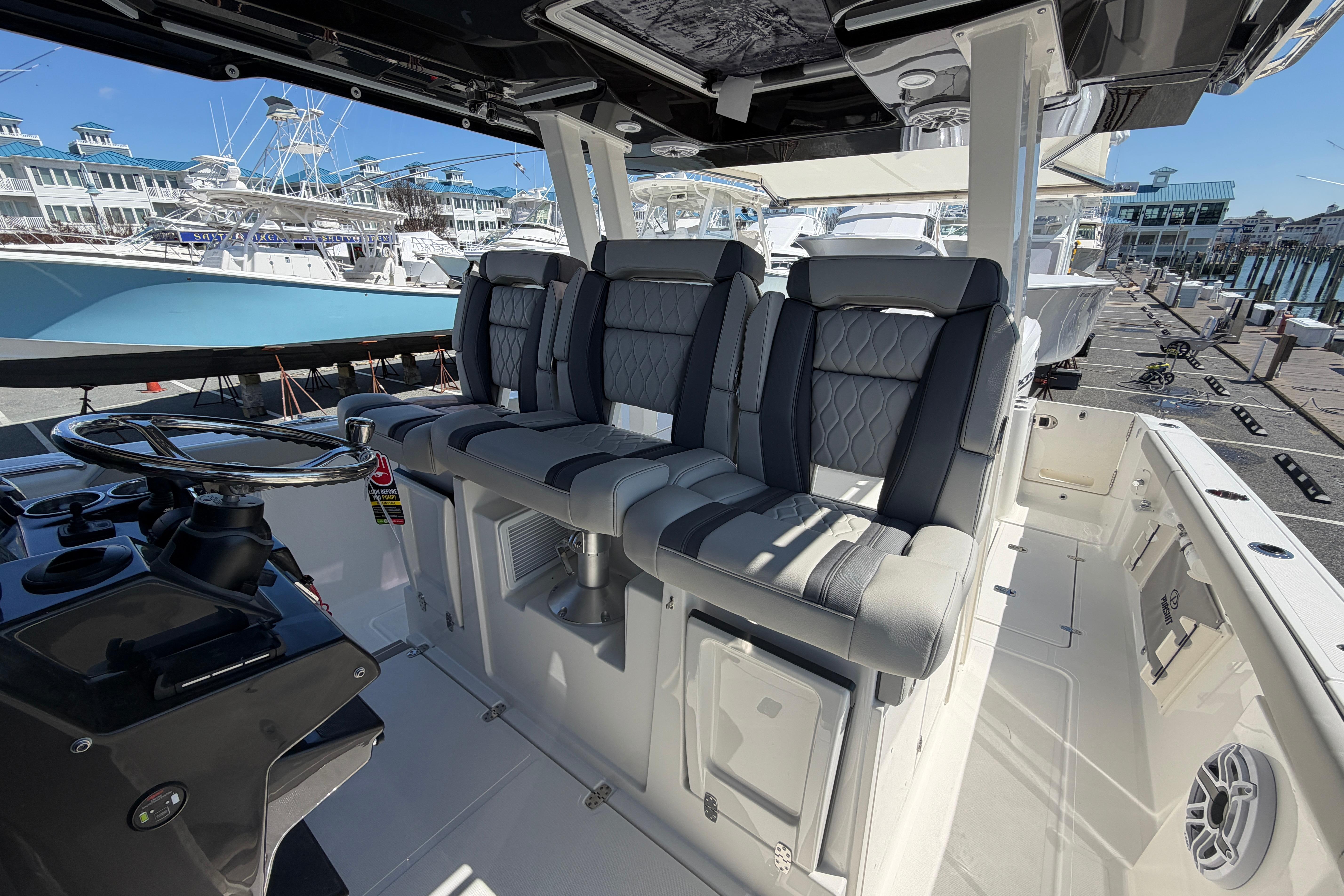 Interior view of 2026 Pursuit S 358 Sport boat with luxurious seating and helm.