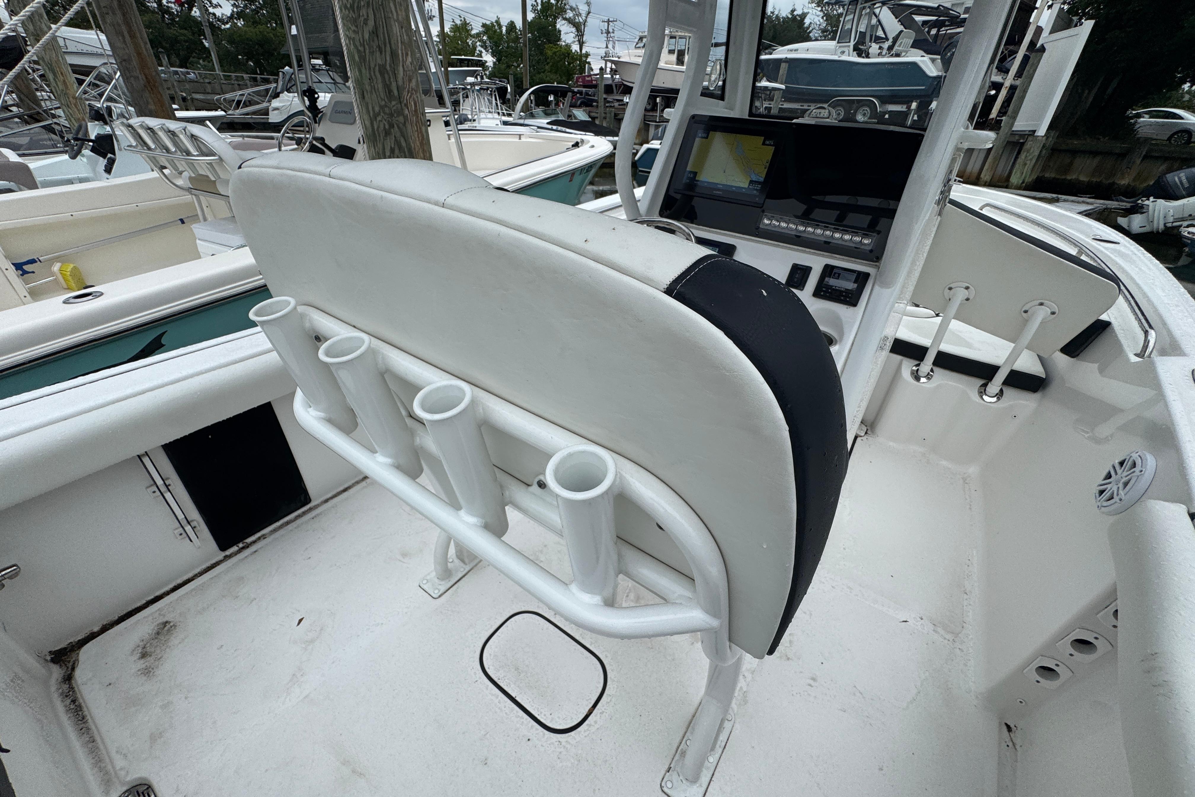 2022 Tidewater 232 SS boat interior with rod holders and navigation console.