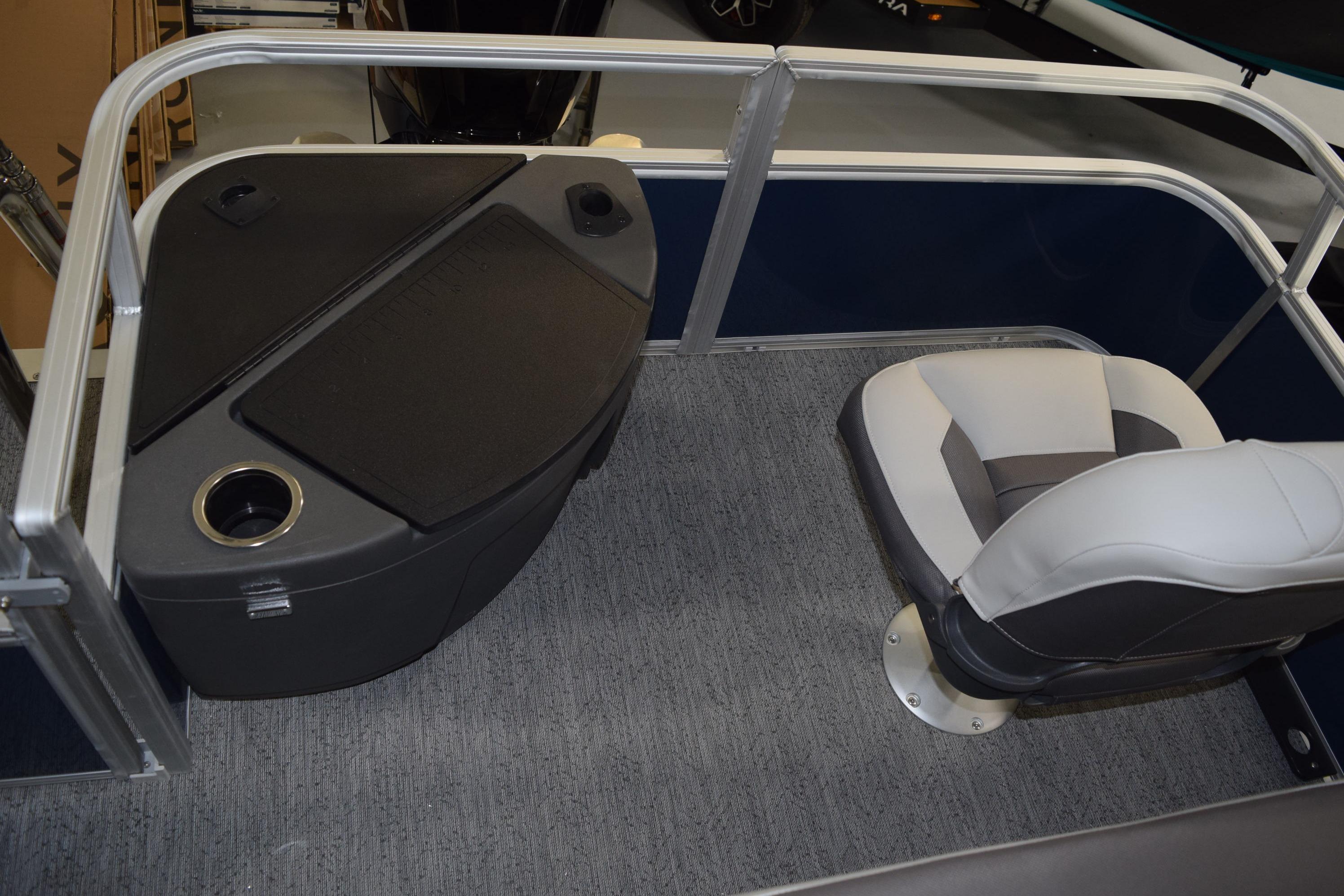 2026 Sun Tracker Bass Buggy 18 DLX interior with seating and storage area.
