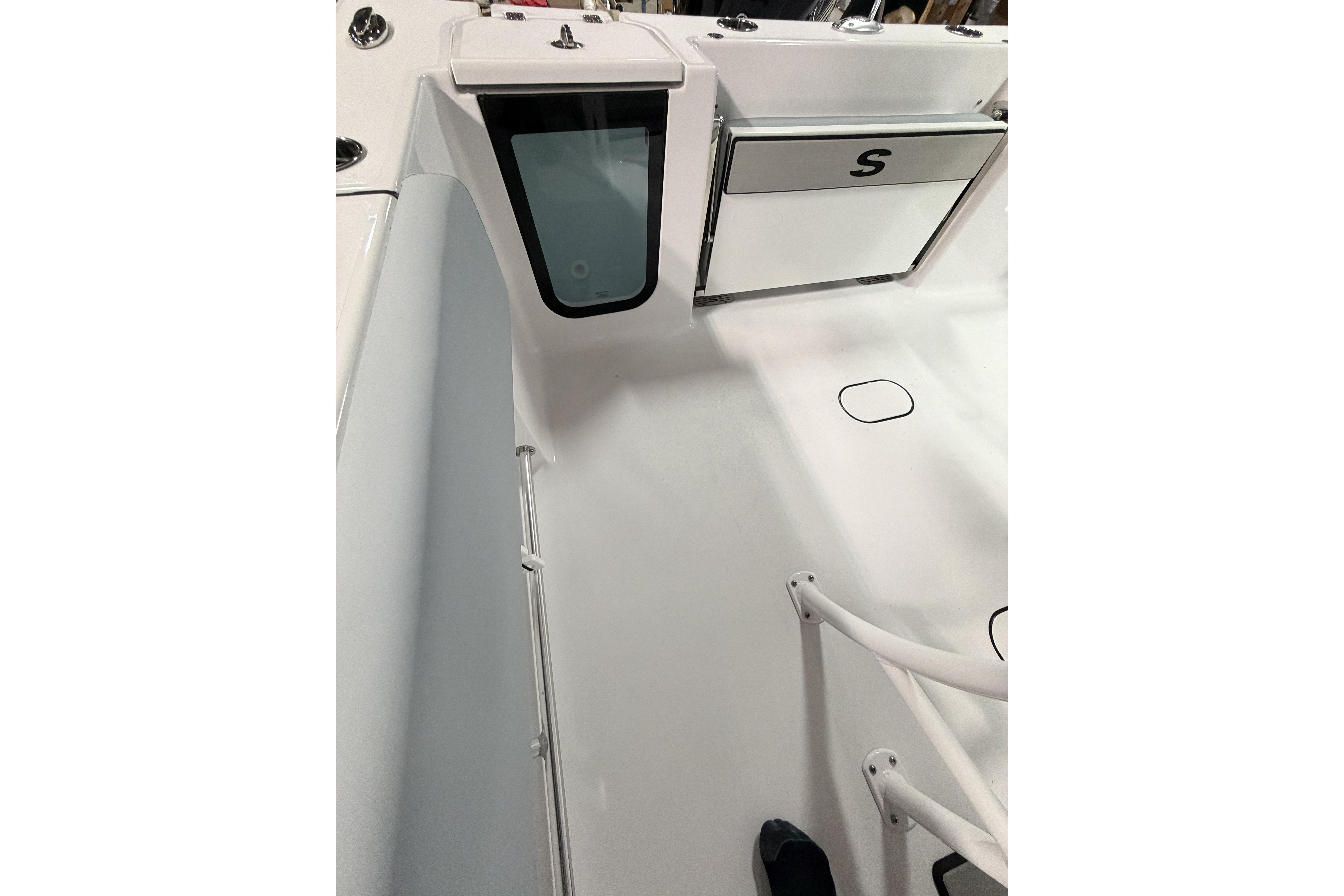 2026 Sportsman Open 232 Center Console interior with storage compartment and sleek design.