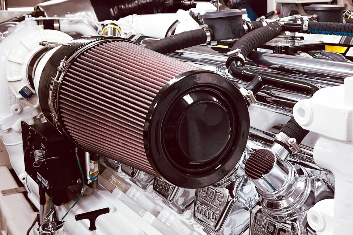 Engine compartment of a 2001 Nordlund Enclosed Command Bridge yacht, featuring detailed components.