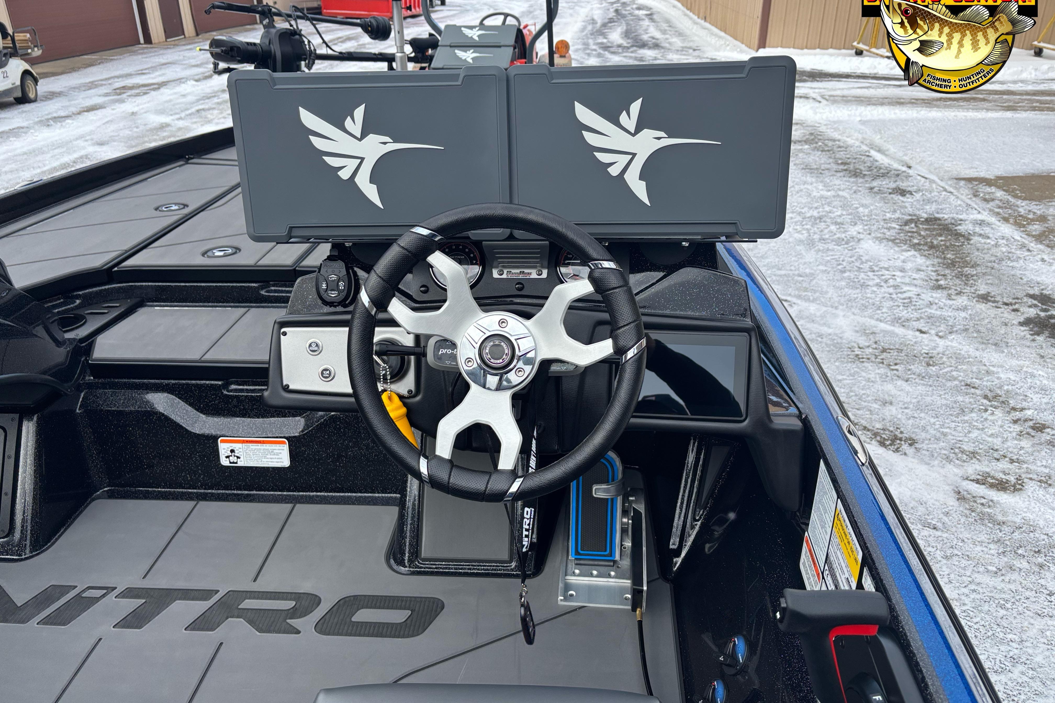 2026 Nitro Z21 XL boat cockpit with dual screens and steering wheel.