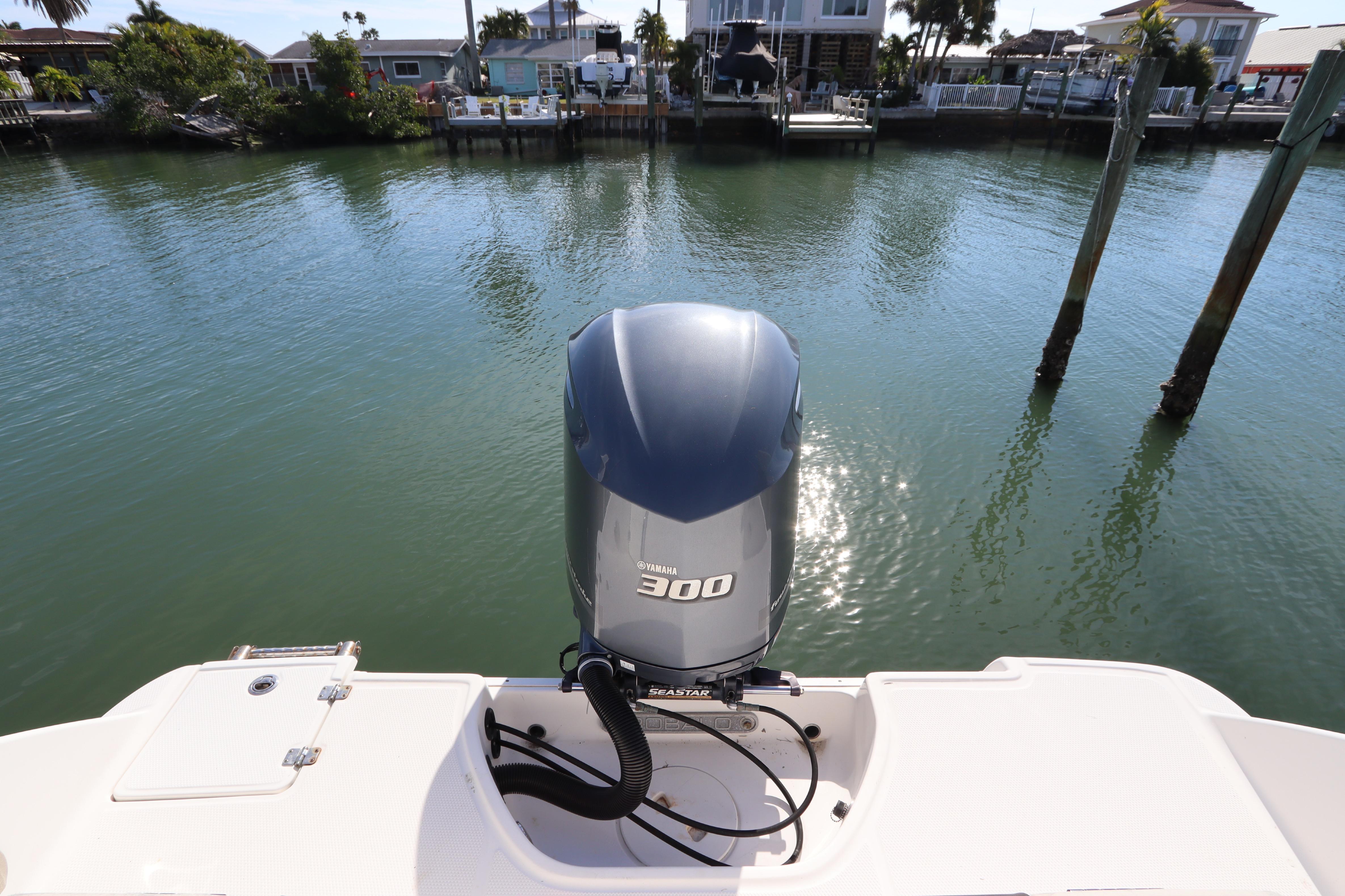 2019 Robalo R242 Center Console with Yamaha 300 engine on calm water.