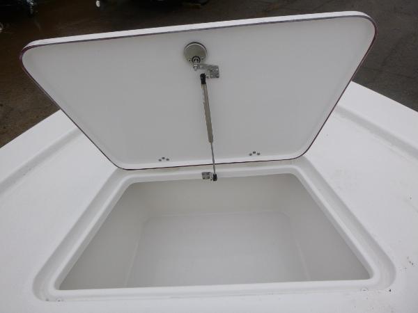 Open storage compartment on 2025 Sea Pro 250 Bay boat.