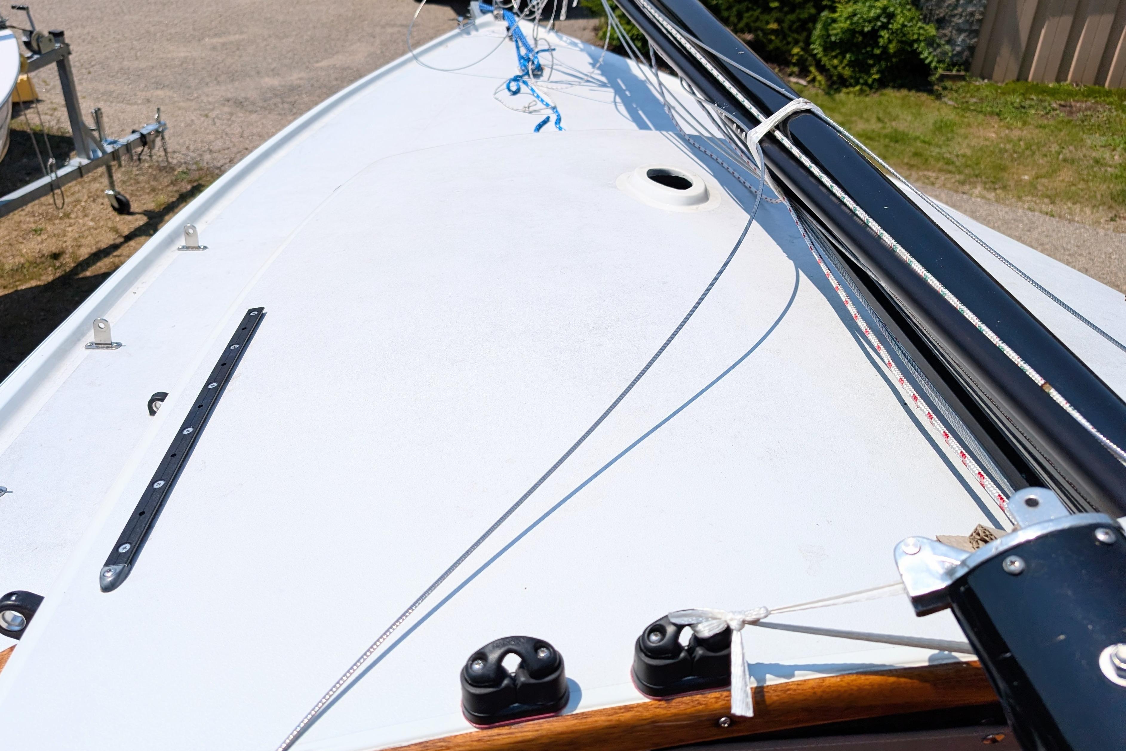 1965 Pearson Ensign sailboat deck with rigging and mast details.