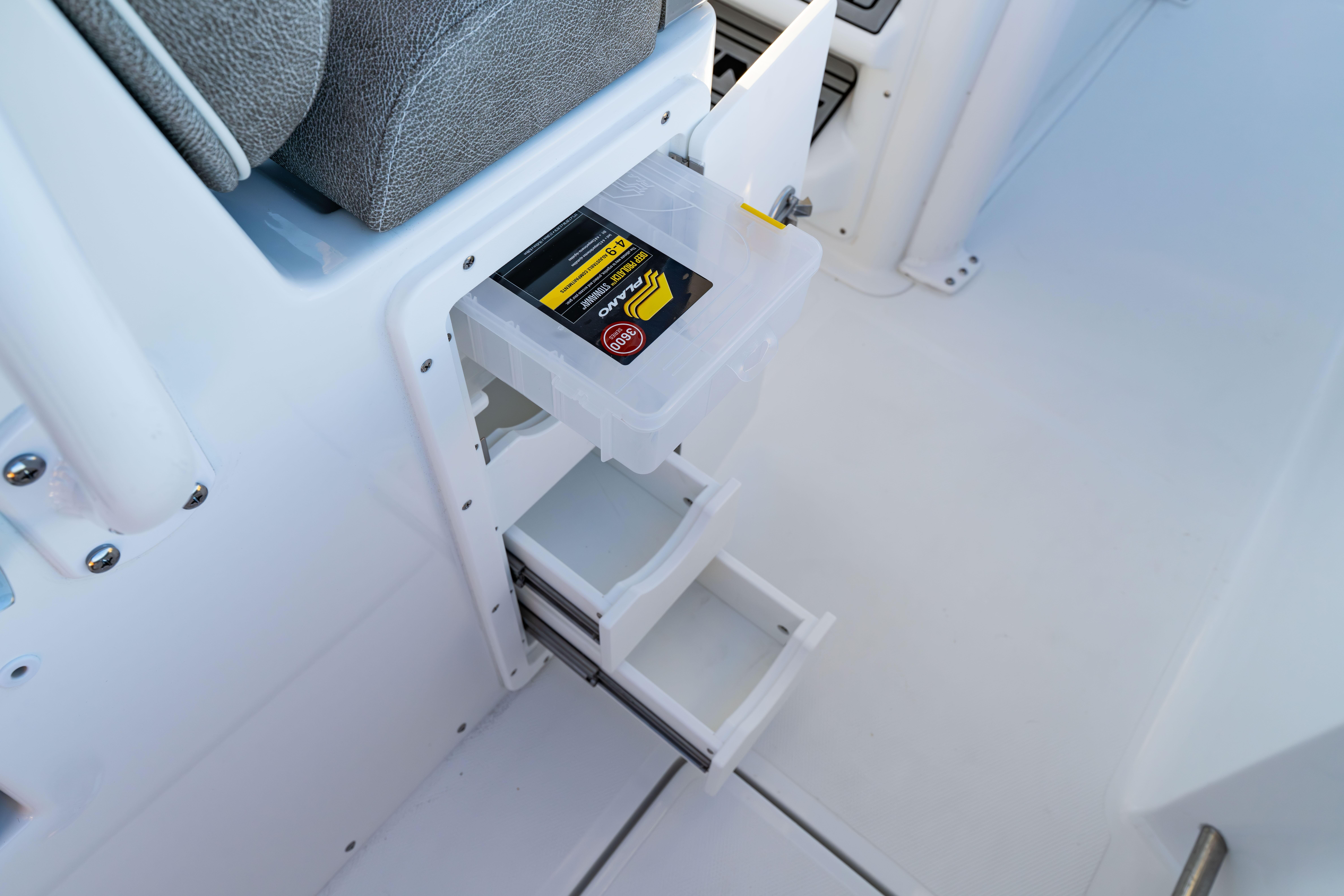 Storage compartment on 2026 Sea Hunt Ultra 275 Coffin Box boat, featuring organized drawers.