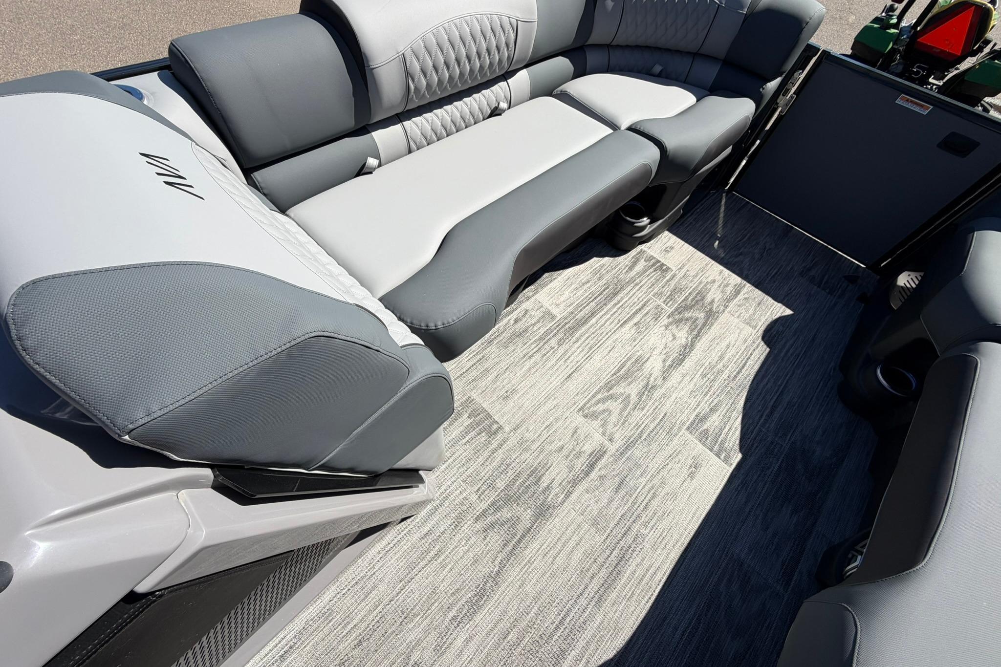 Luxurious seating in 2026 Avalon Excalibur LTD Quad Lounge boat interior.