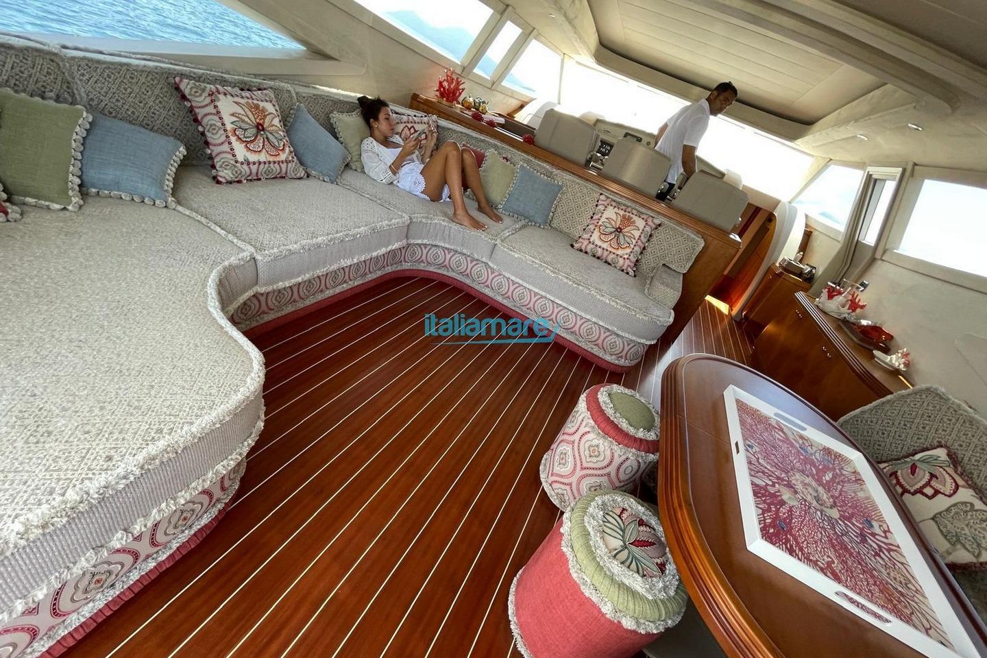 Luxurious interior of 2025 Alalunga Open 85 Sport X yacht with elegant seating and decor.