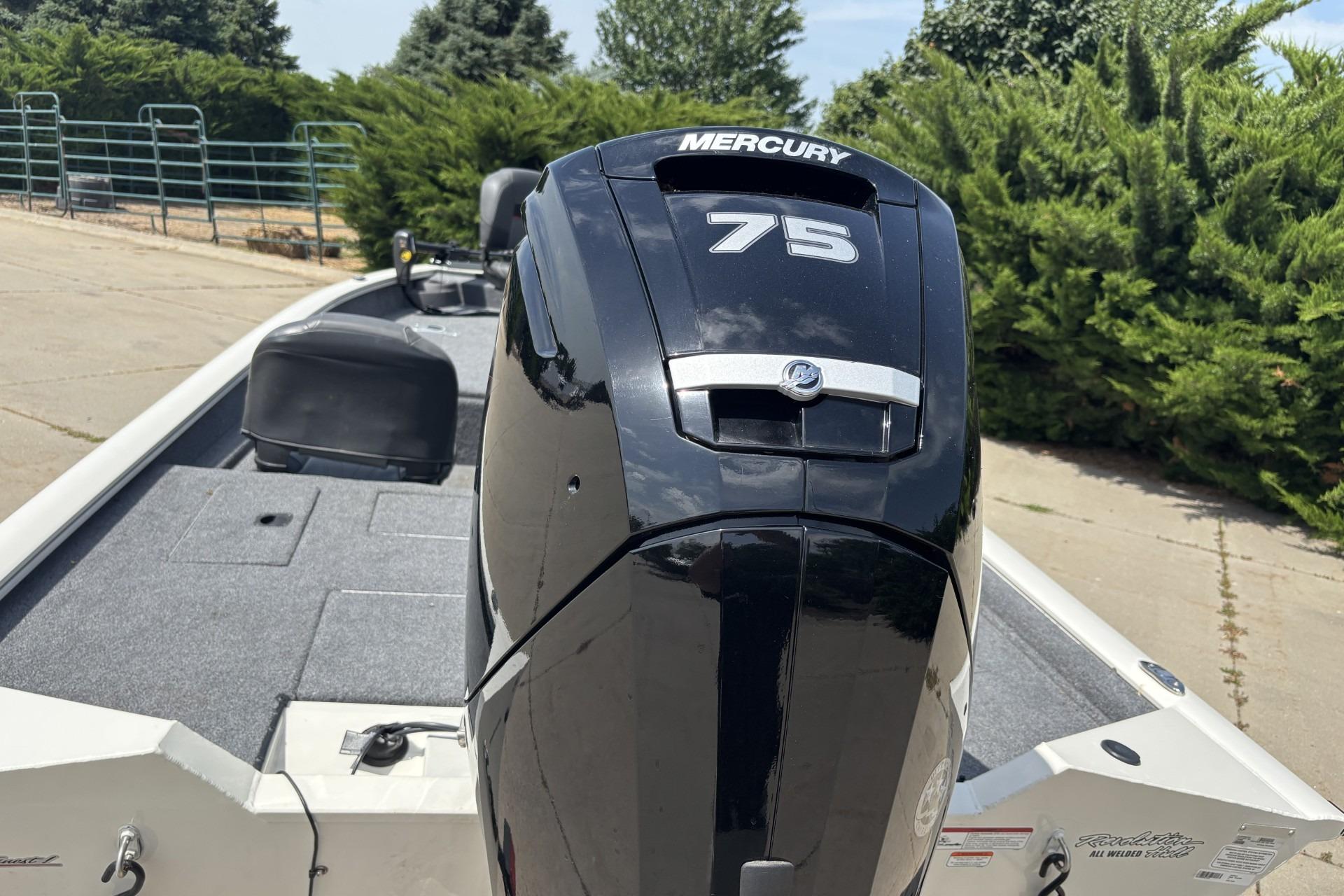 2024 Tracker Pro Team 175 TF boat with Mercury 75 engine, parked outdoors.