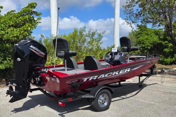 2025 Tracker Pro Team 175 boat with Mercury engine, parked outdoors.