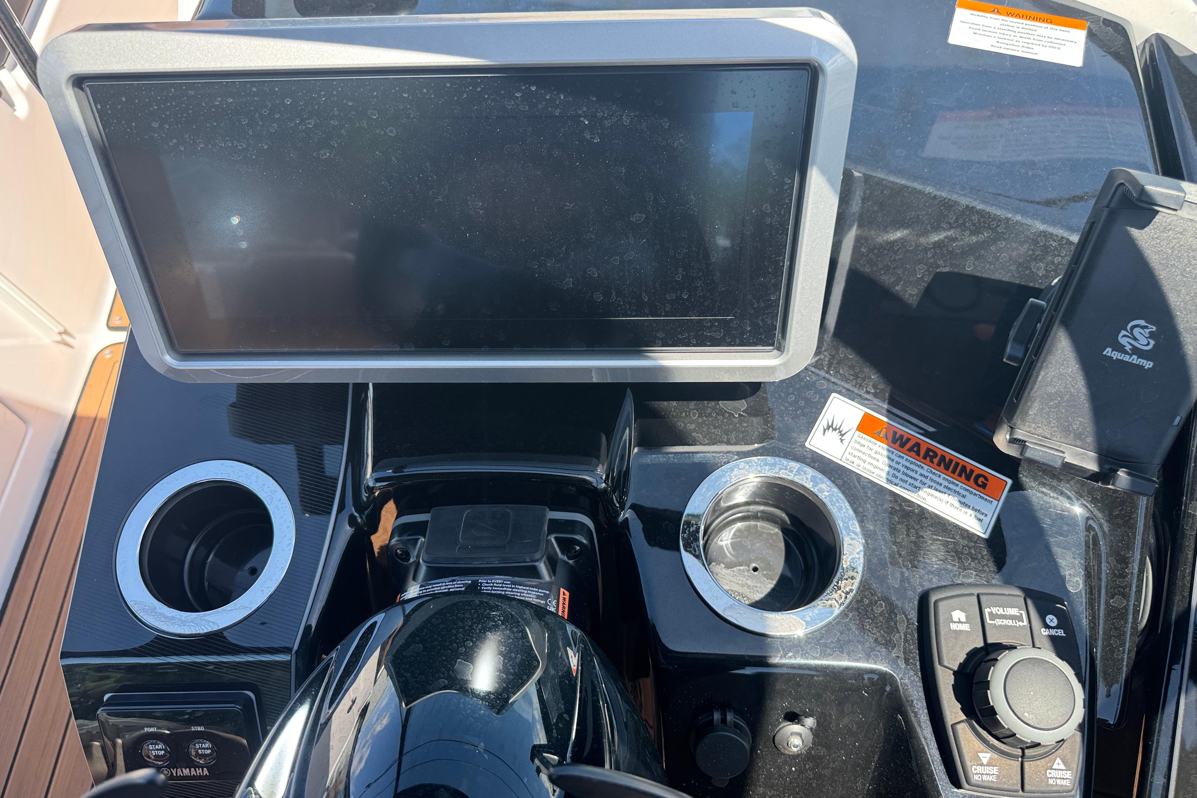 2026 Yamaha Boats 252SD dashboard with touchscreen, controls, and cup holders.