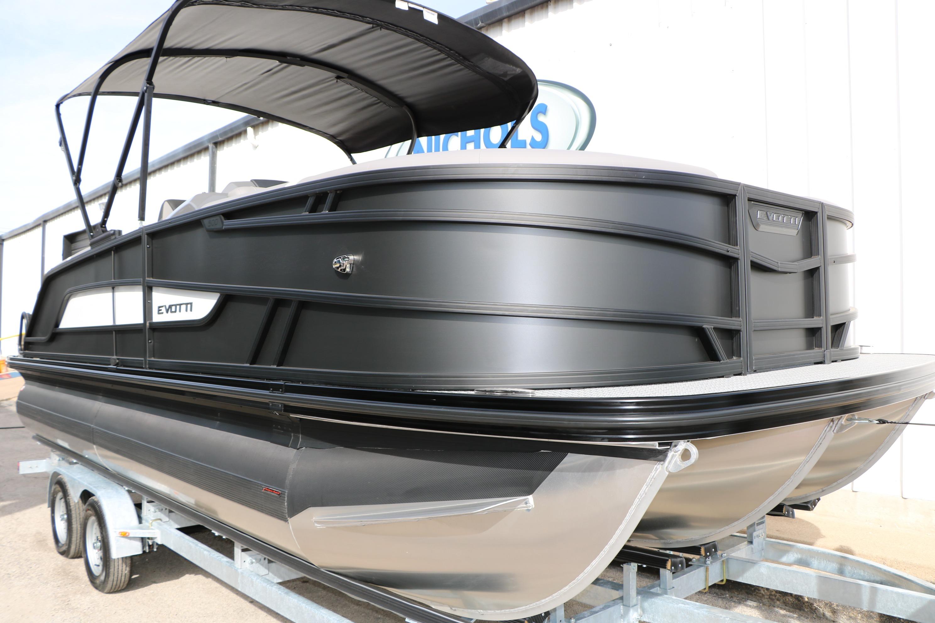 2026 Evotti 521QL pontoon boat on trailer, featuring sleek black design and canopy.