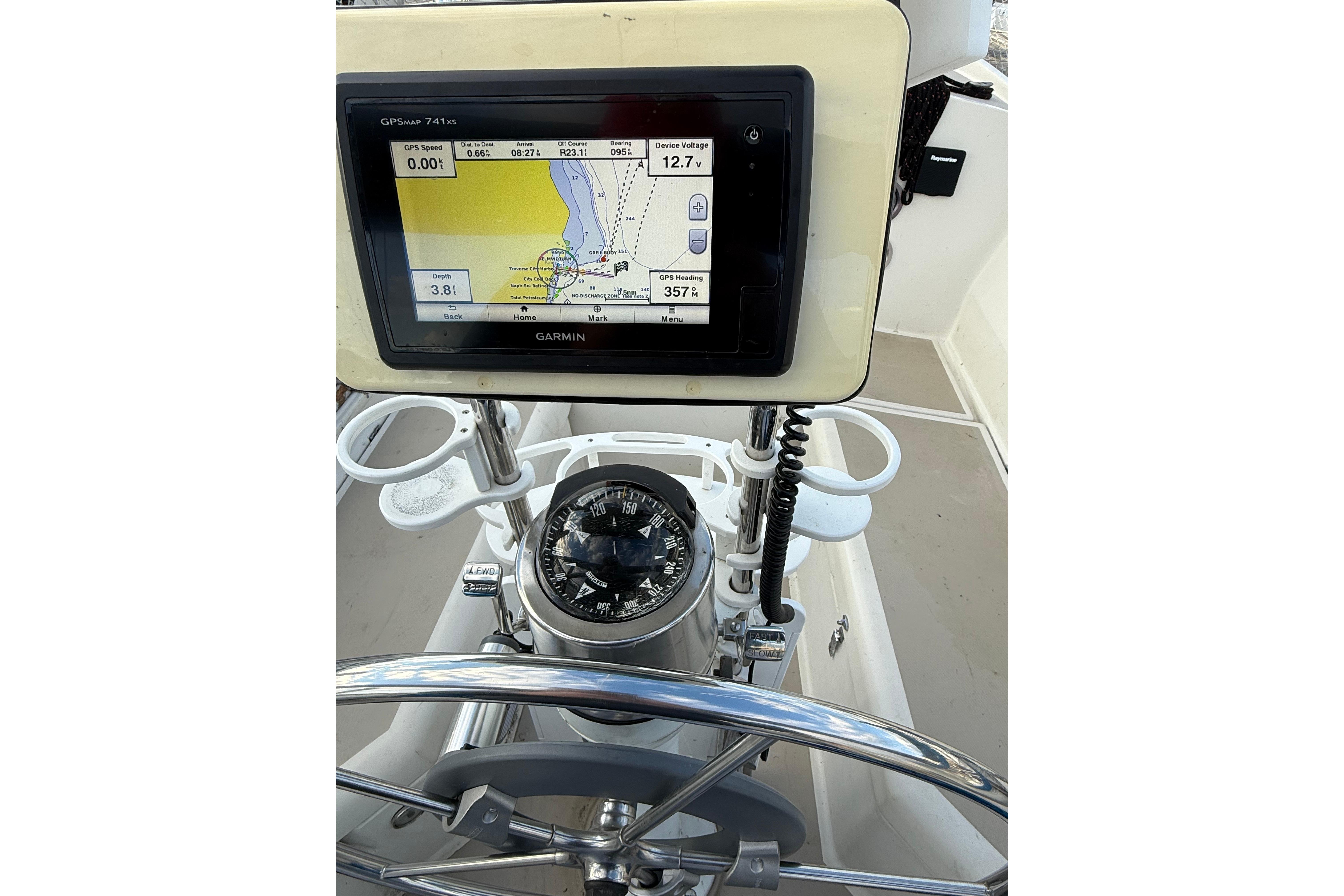 Cockpit of 1983 O'Day 34 sailboat with Garmin GPS and compass.
