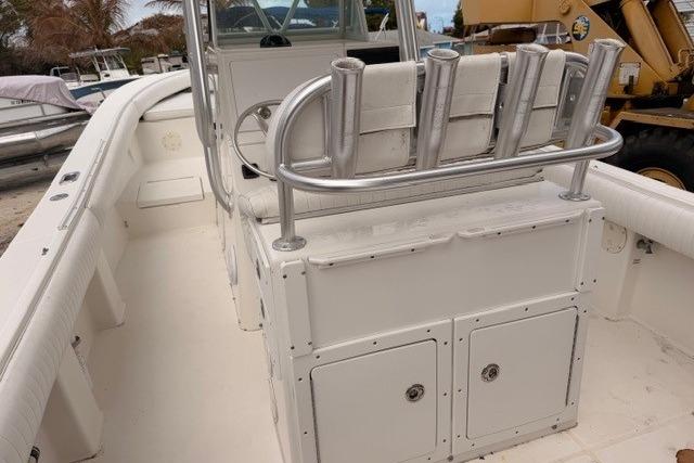 2002 Regulator 26 Forward Seating boat interior with rod holders and storage compartments.