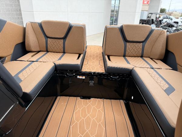 2025 Yamaha Boats 255XD interior with tan and black seating, modern design.